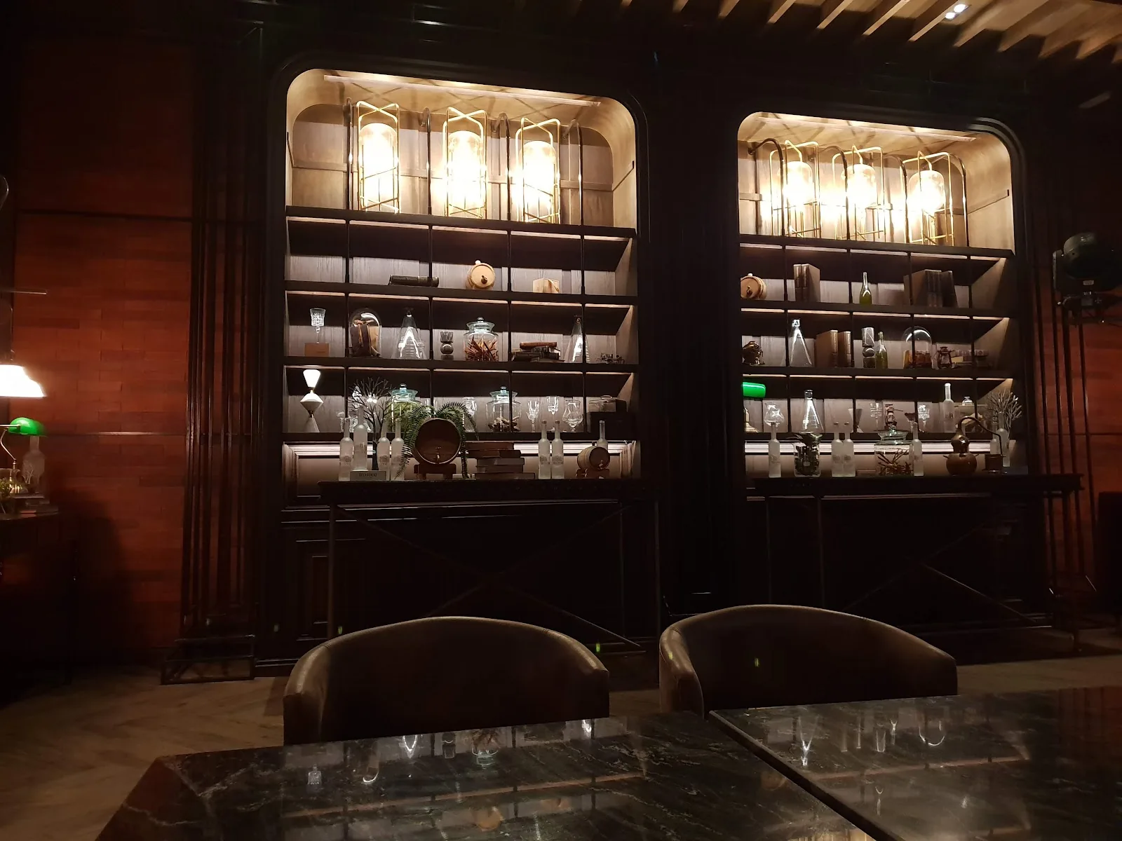 ABar - add elegant indoor lounge with arched alcove shelving and armchair seating speakeasy style interior