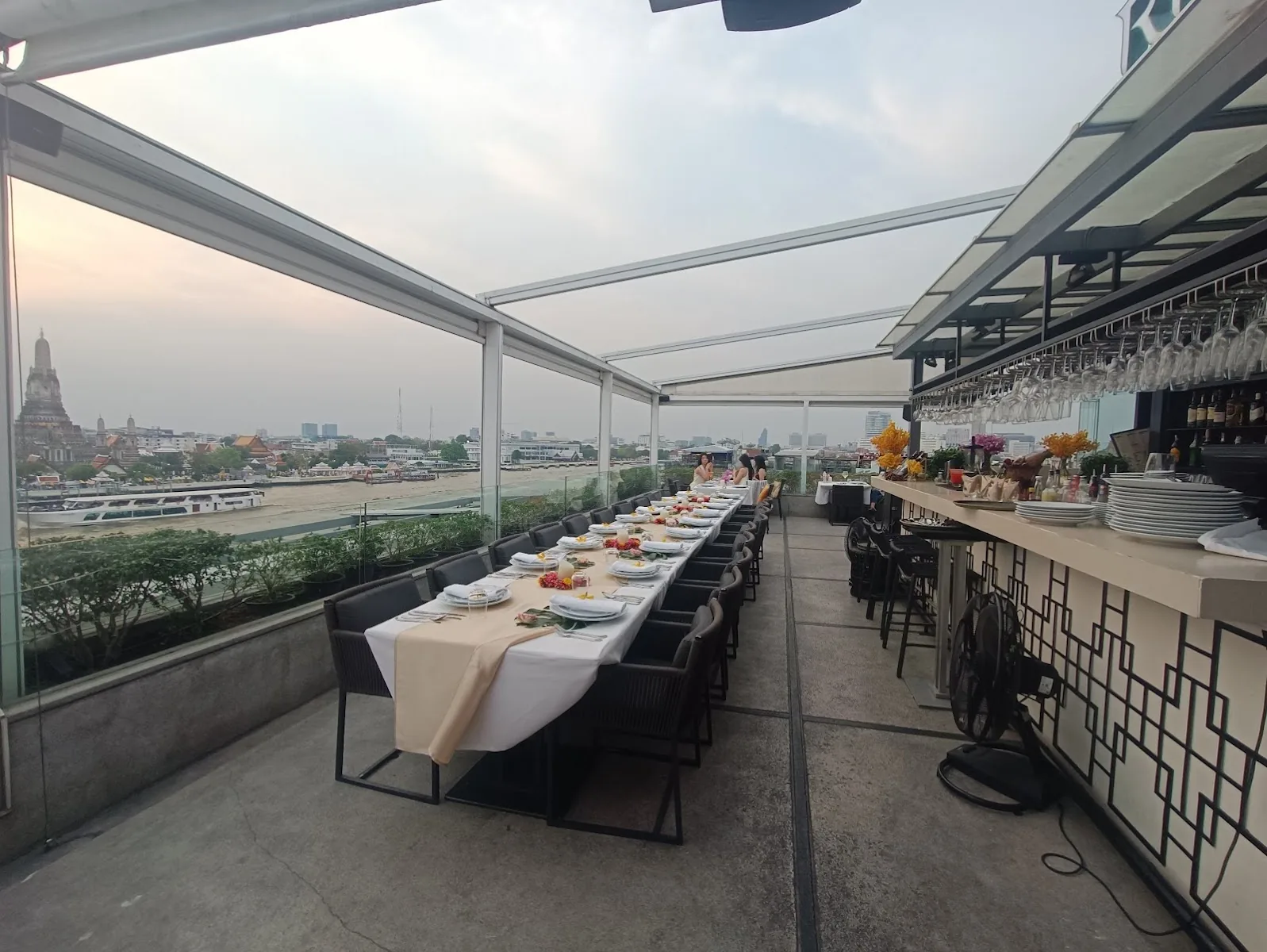 Above Riva - fix rooftop bar counter and dining terrace wat arun dusk