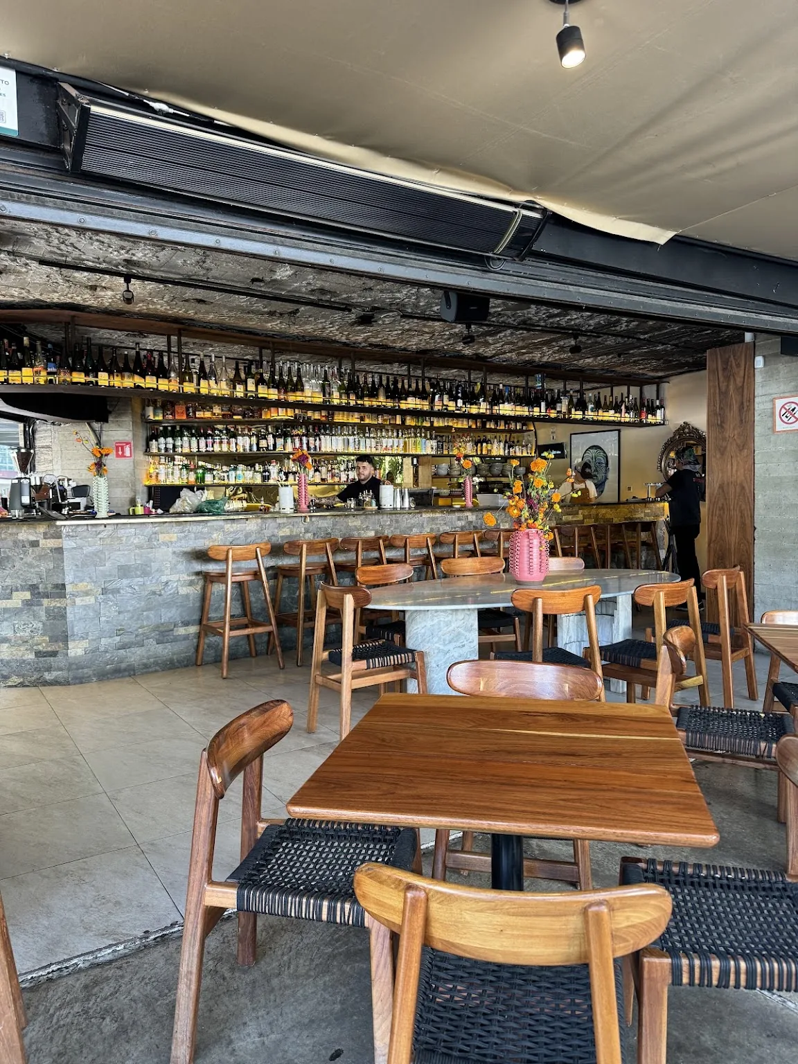 Anonimo Colectivo - dining area under the skylight awning