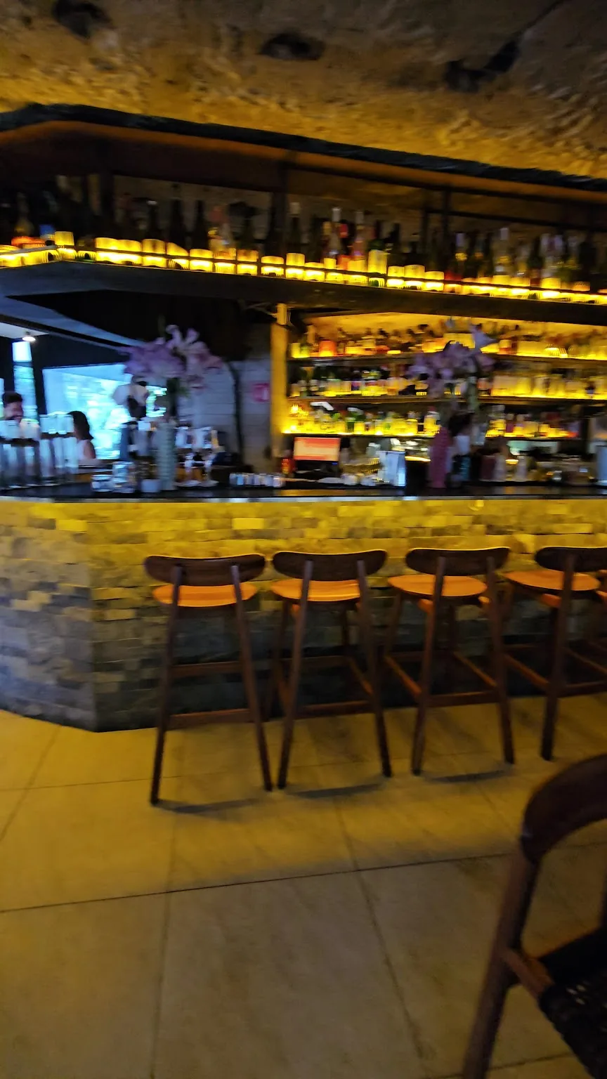 Anonimo Colectivo - bar counter with stools