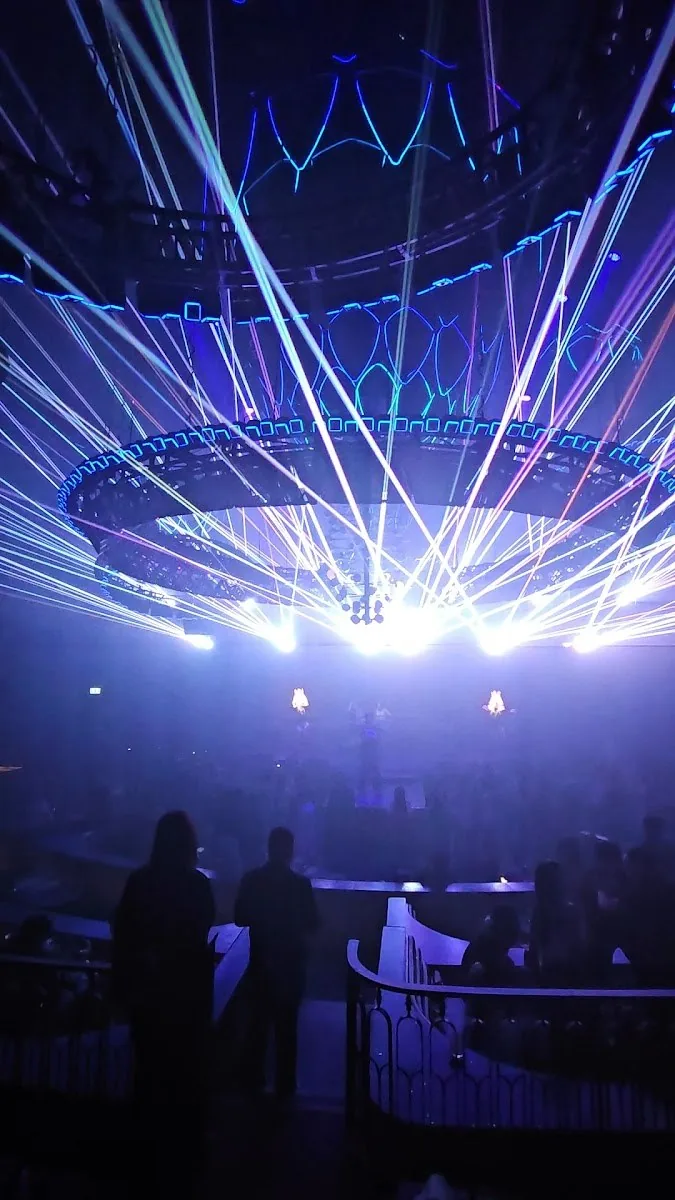 Atlas Superclub - fix kinetic chandelier ring firing radiating light beams over the balcony room room in action