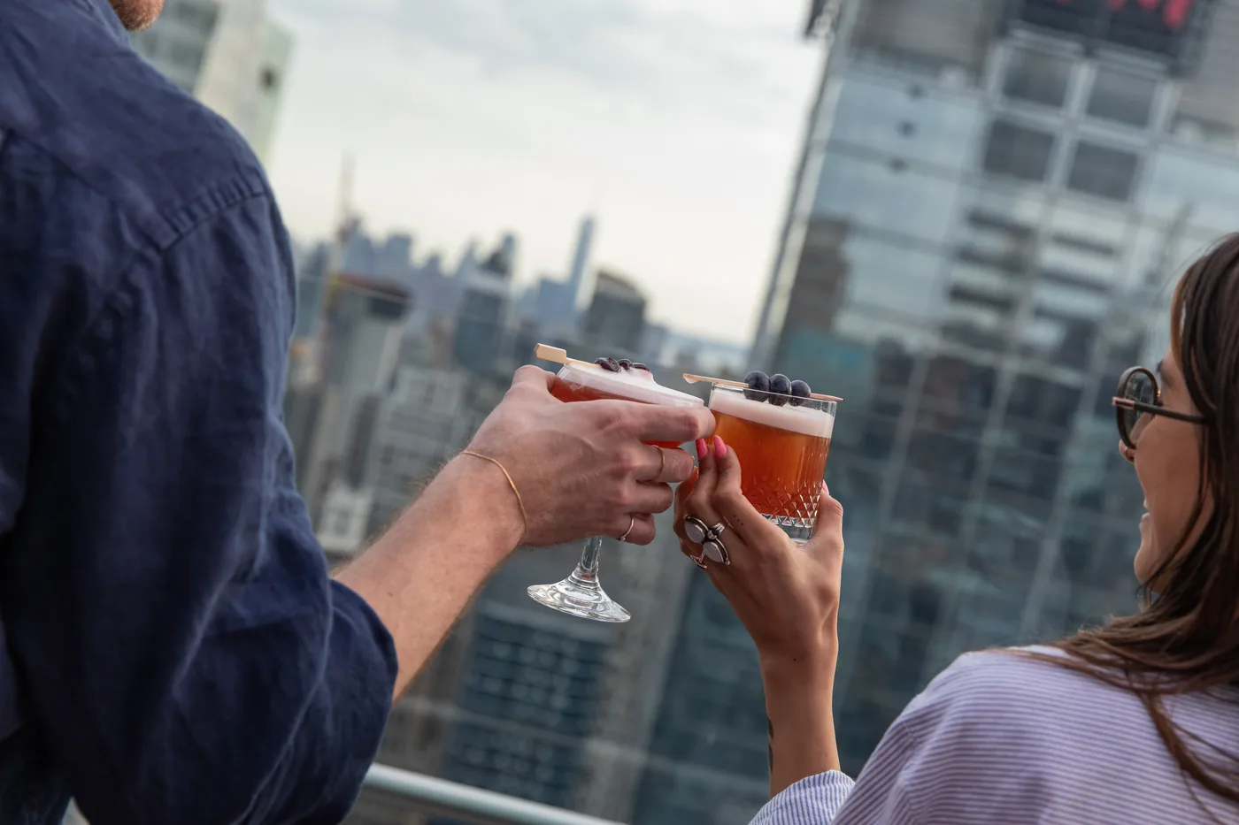 Bar 54 - cocktails toast over midtown skyline