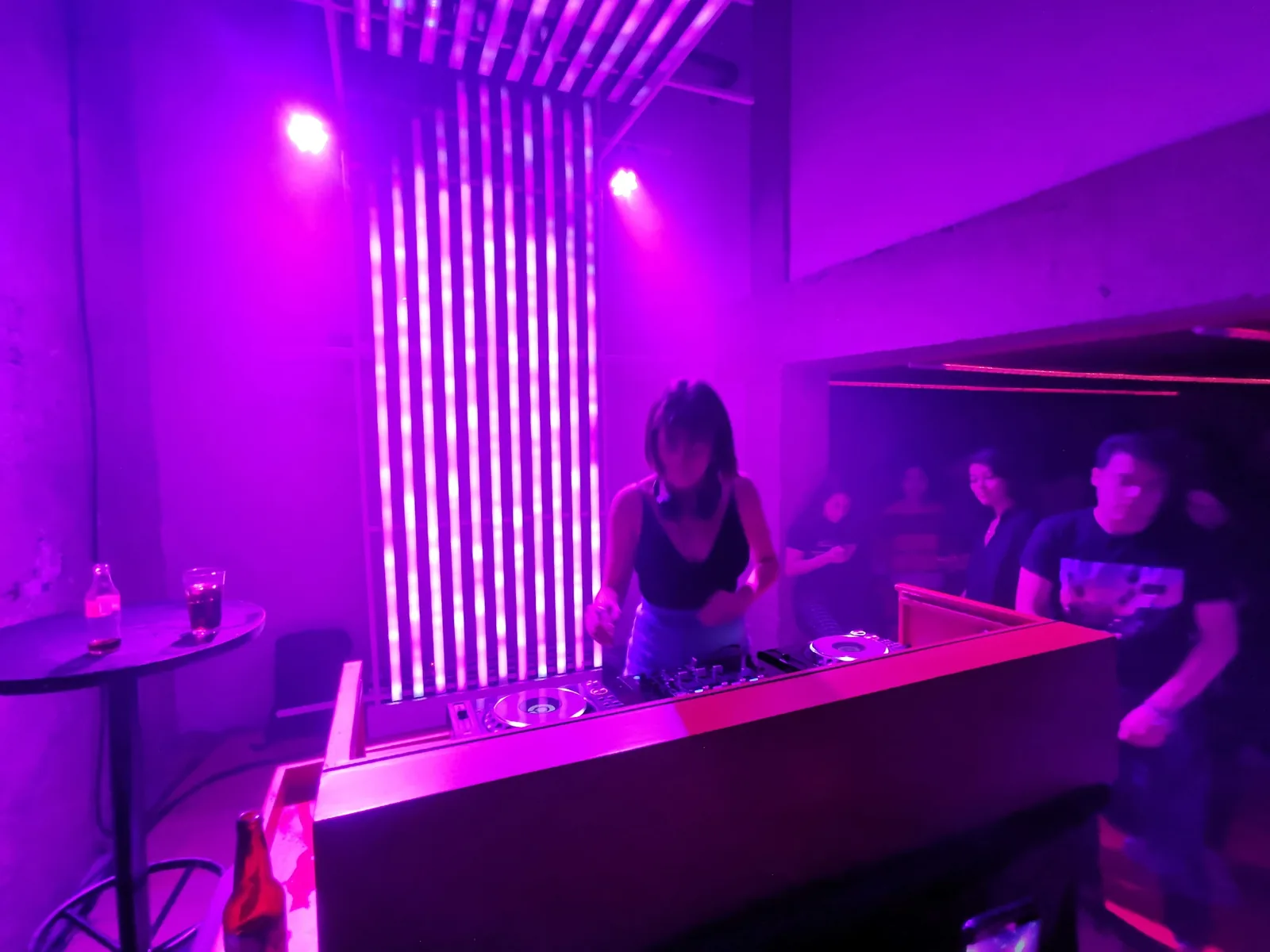 Bar Oriente - dj booth against the pink led wall