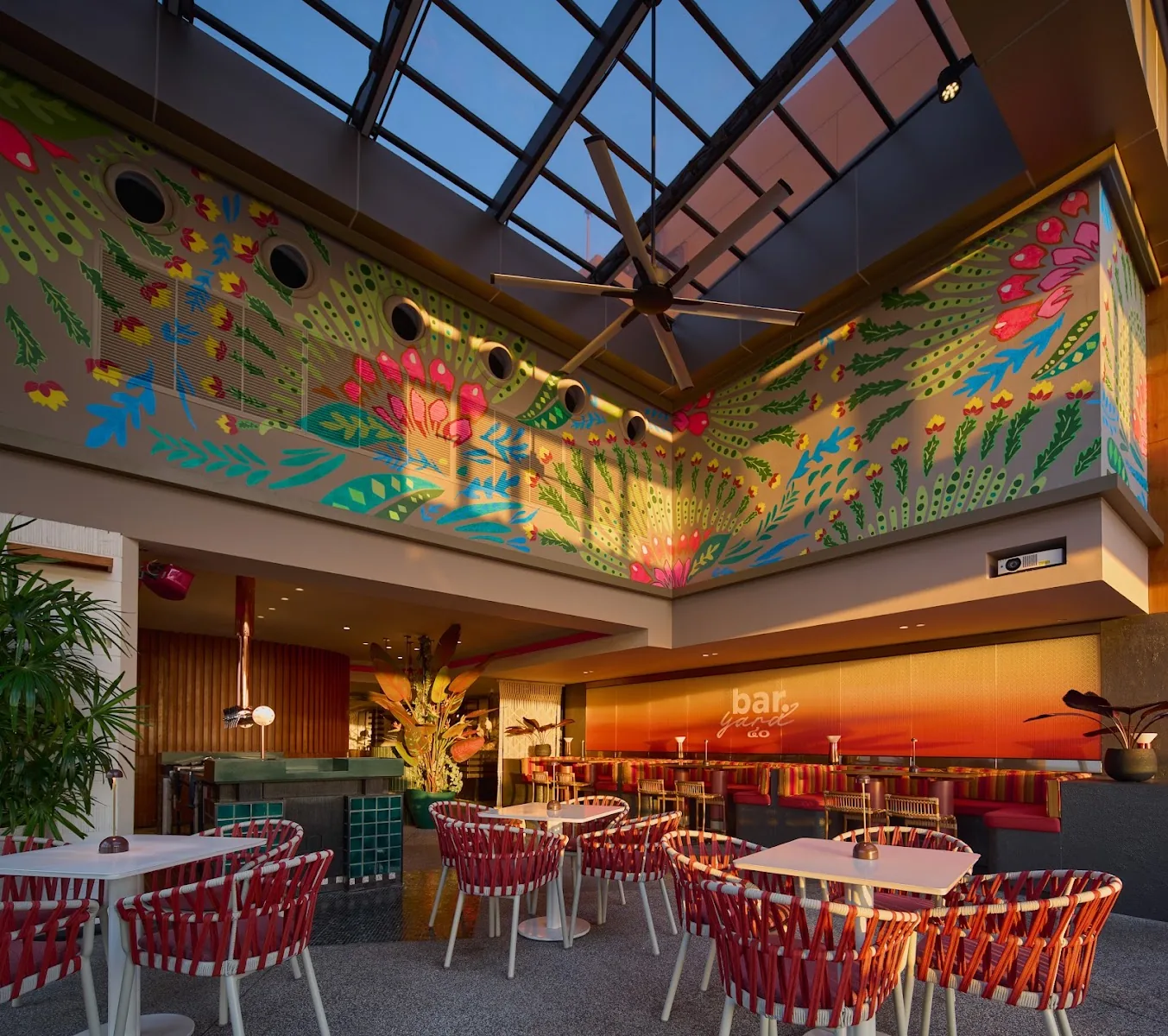 Bar.Yard - add bright double height dining hall with colorful tropical jungle murals skylight and red rattan seating