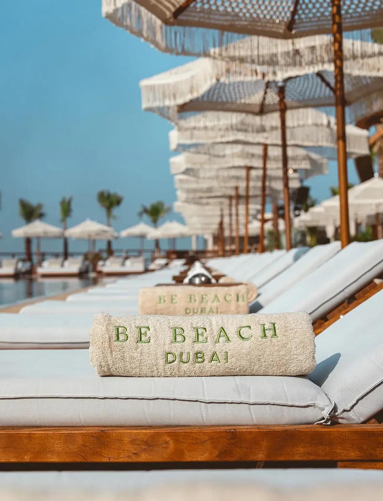 BE BEACH - branded sunbeds on the pool edge