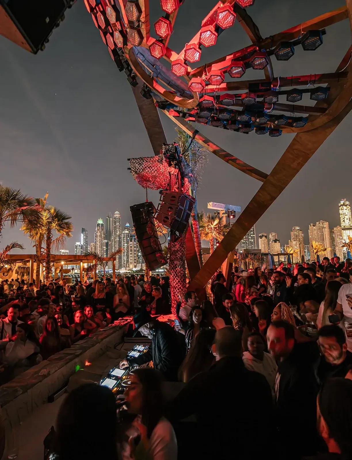 BE BEACH - evening crowd with the dubai marina skyline