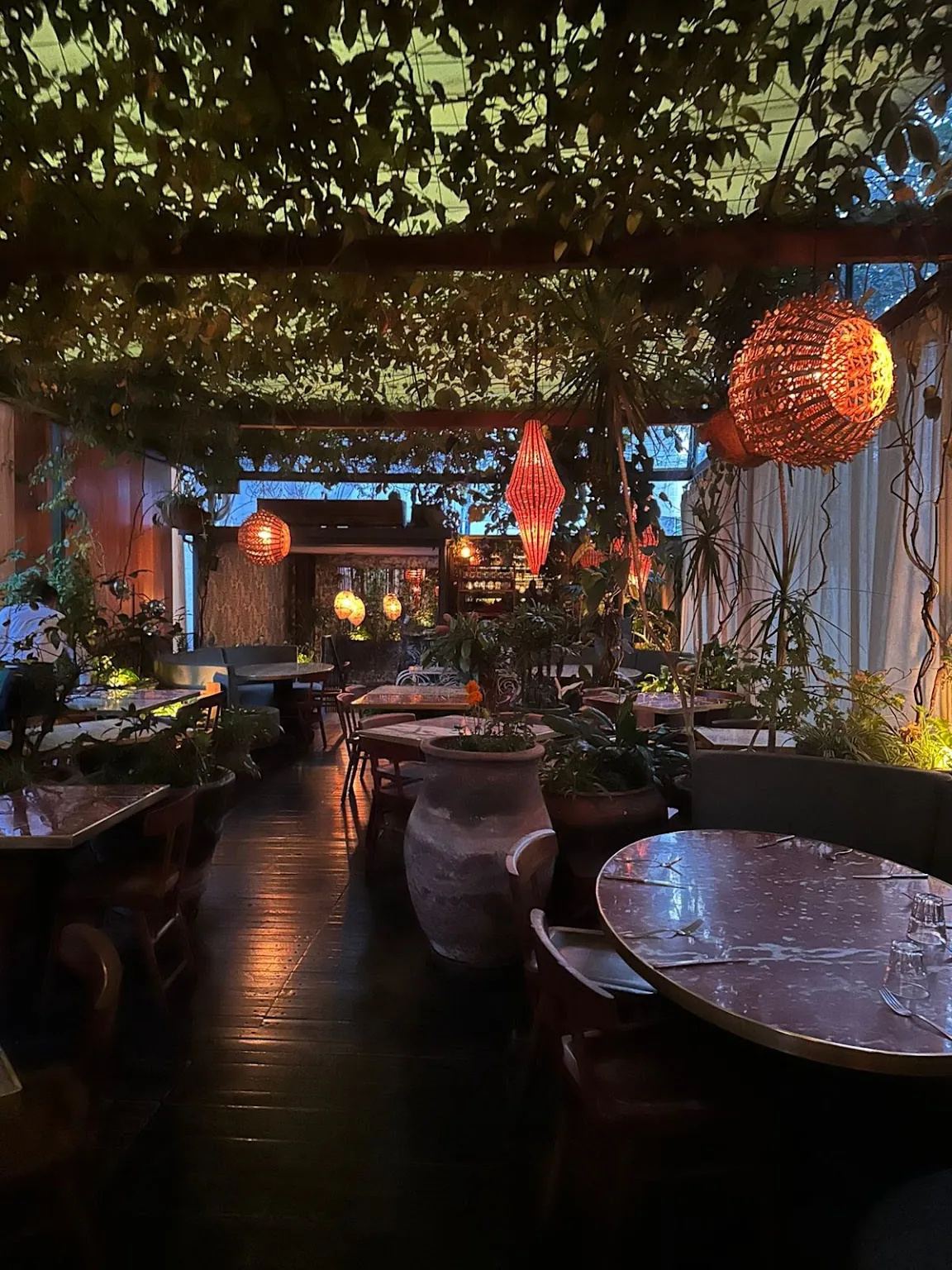 Bella Aurora - interior in the evening with copper tabl