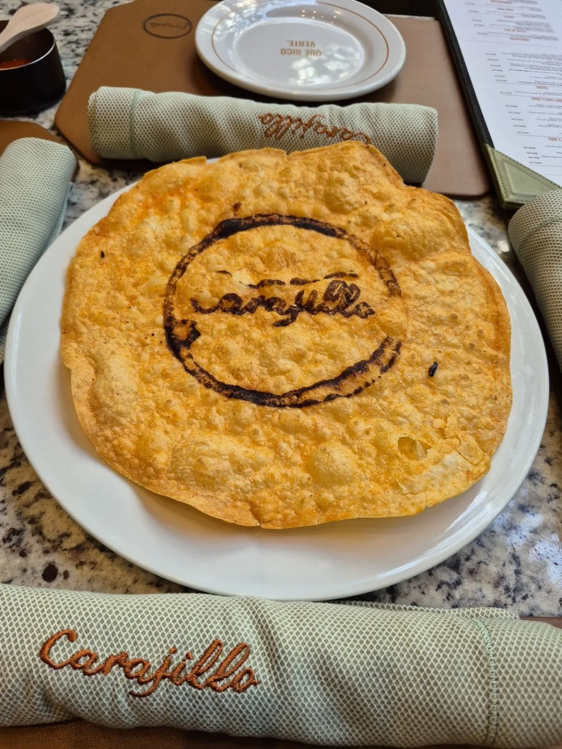 Carajillo - Masaryk - flatbread branded with the carajillo log