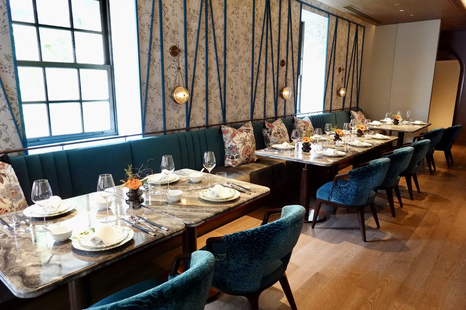 The China House by Chef Fei - add bright main dining room teal velvet chairs marble tables windows