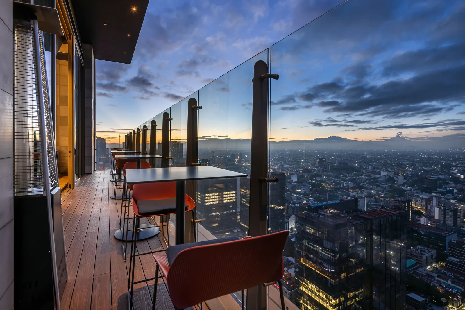 Cityzen Rooftop Kitchen - dining room panoramic dusk skyline