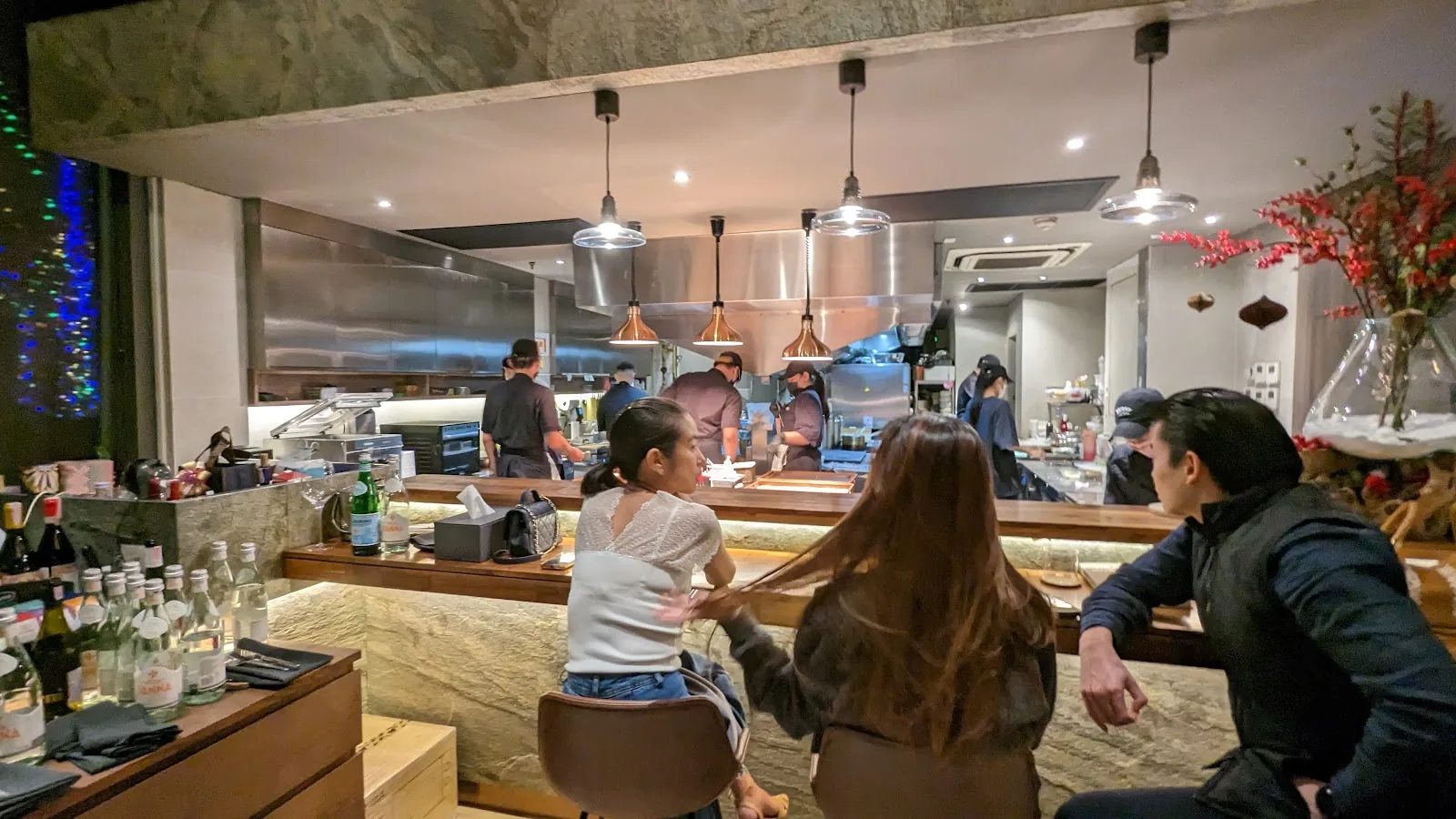Coda - interior lively chef s counter with diners ambiance