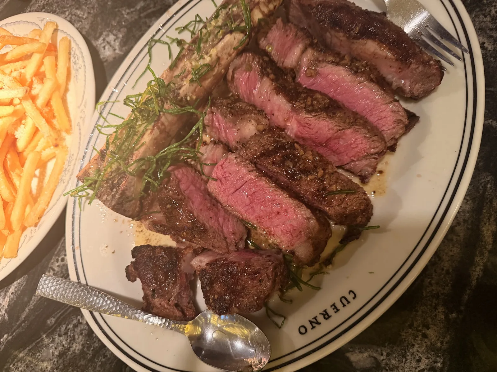Cuerno - Masaryk - sliced ribeye with fries on branded cuer