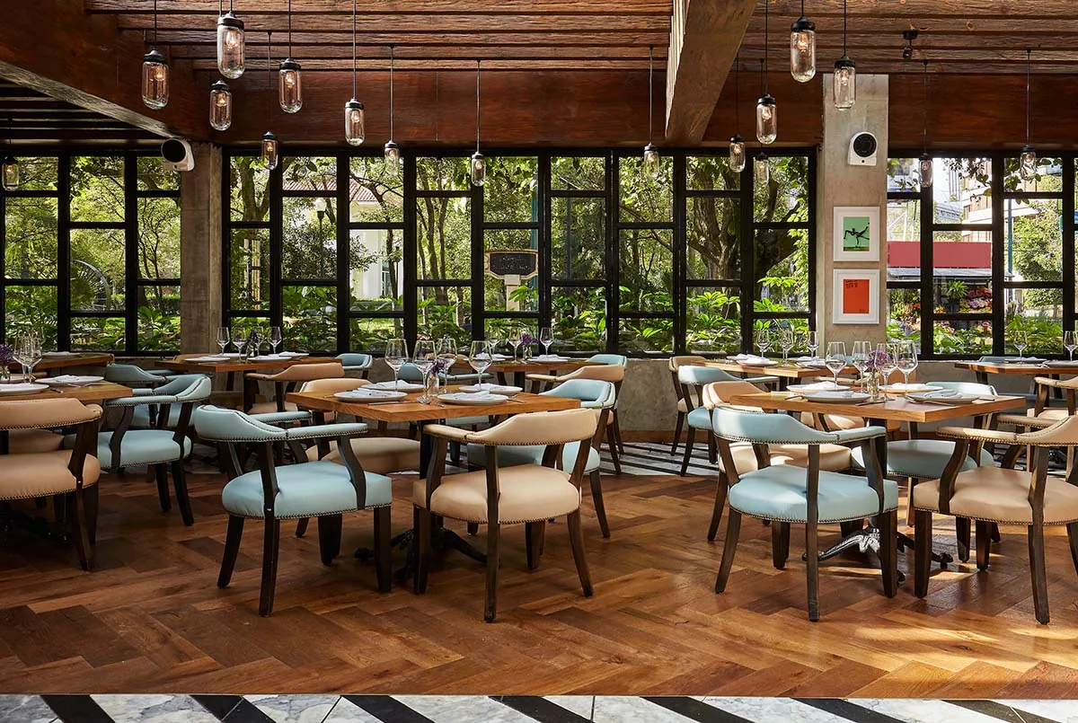 Dante Brasa y Fuego - dining room with tall windows onto the g