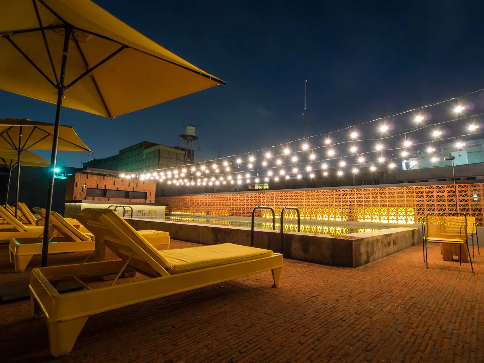 Terraza Downtown - terrace at night under string lights