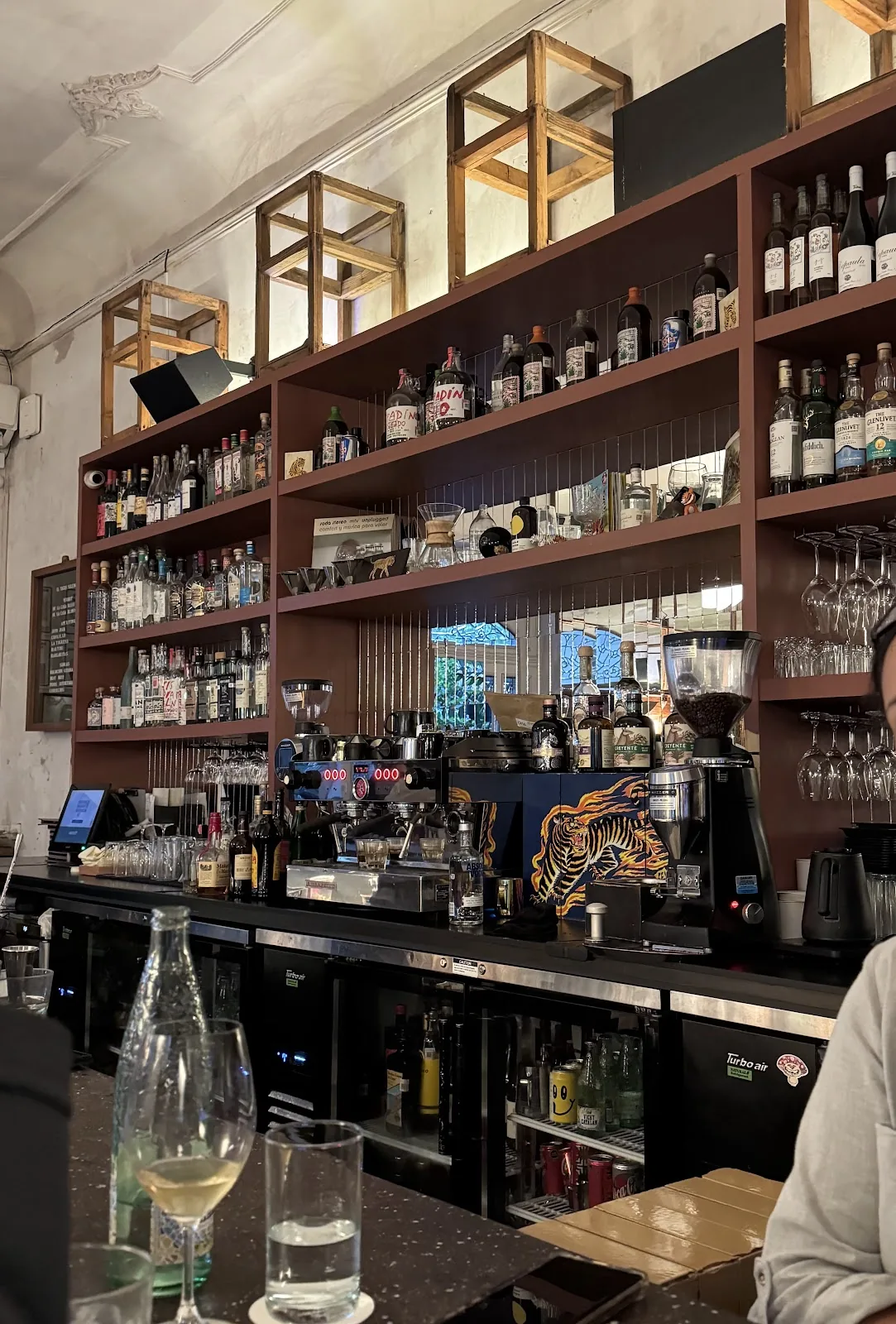 El Tigre Silencioso - back bar with bottle shelves