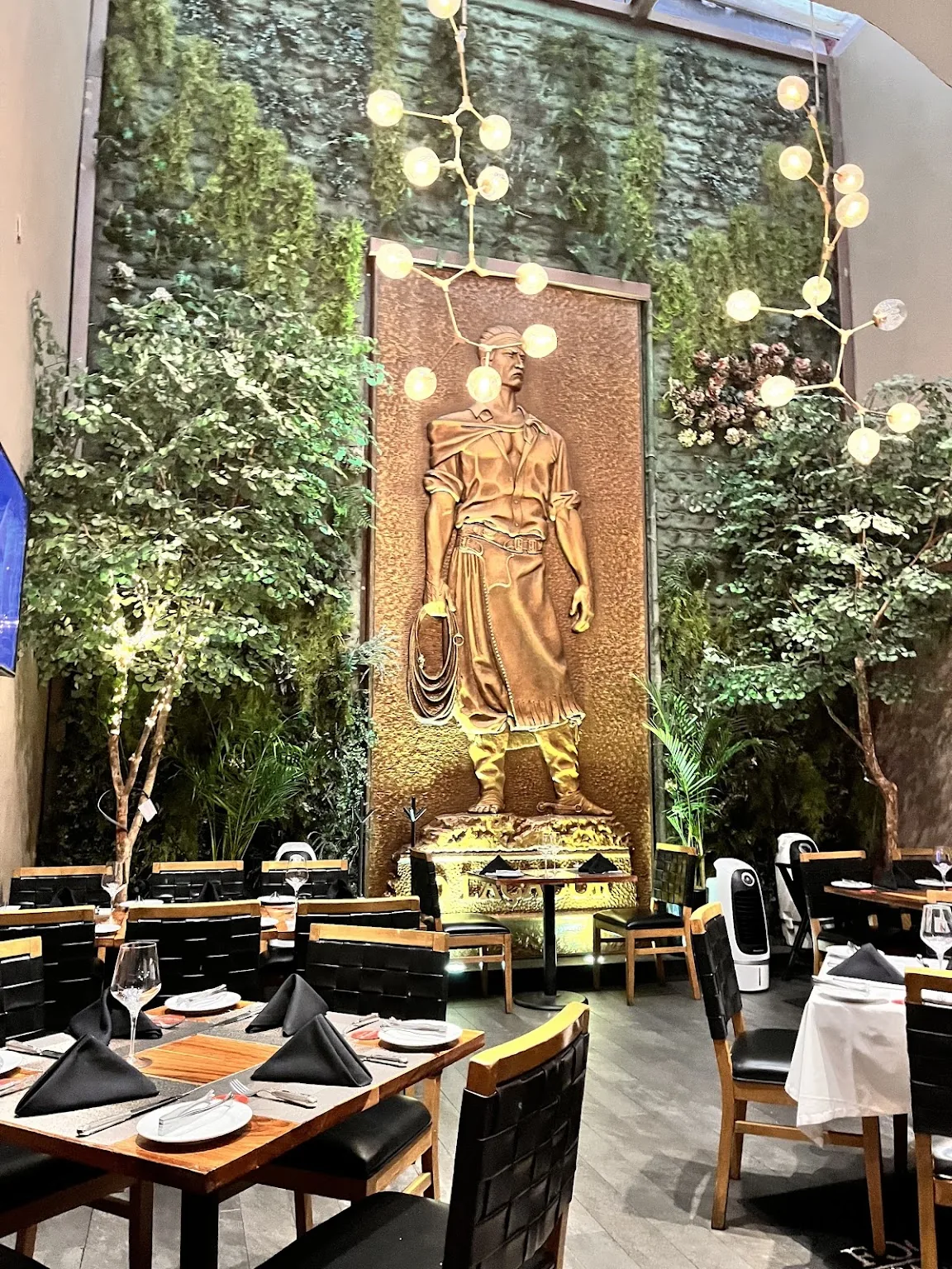 Fogo de Chao - Polanco - dining room against the planted green wa
