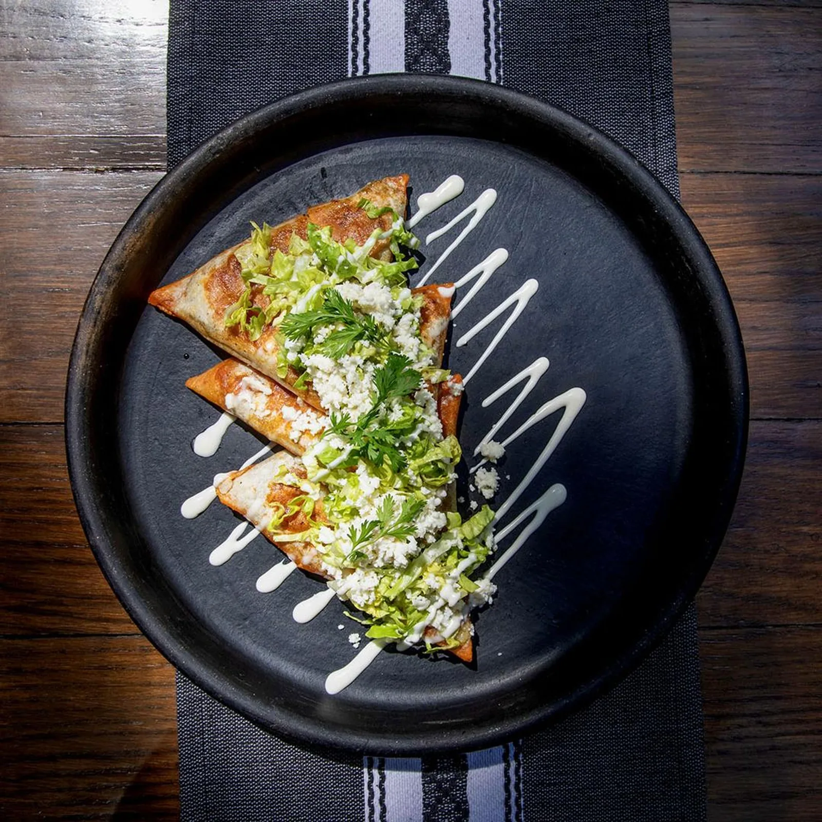 Guzina Oaxaca - tlayudas on black plate