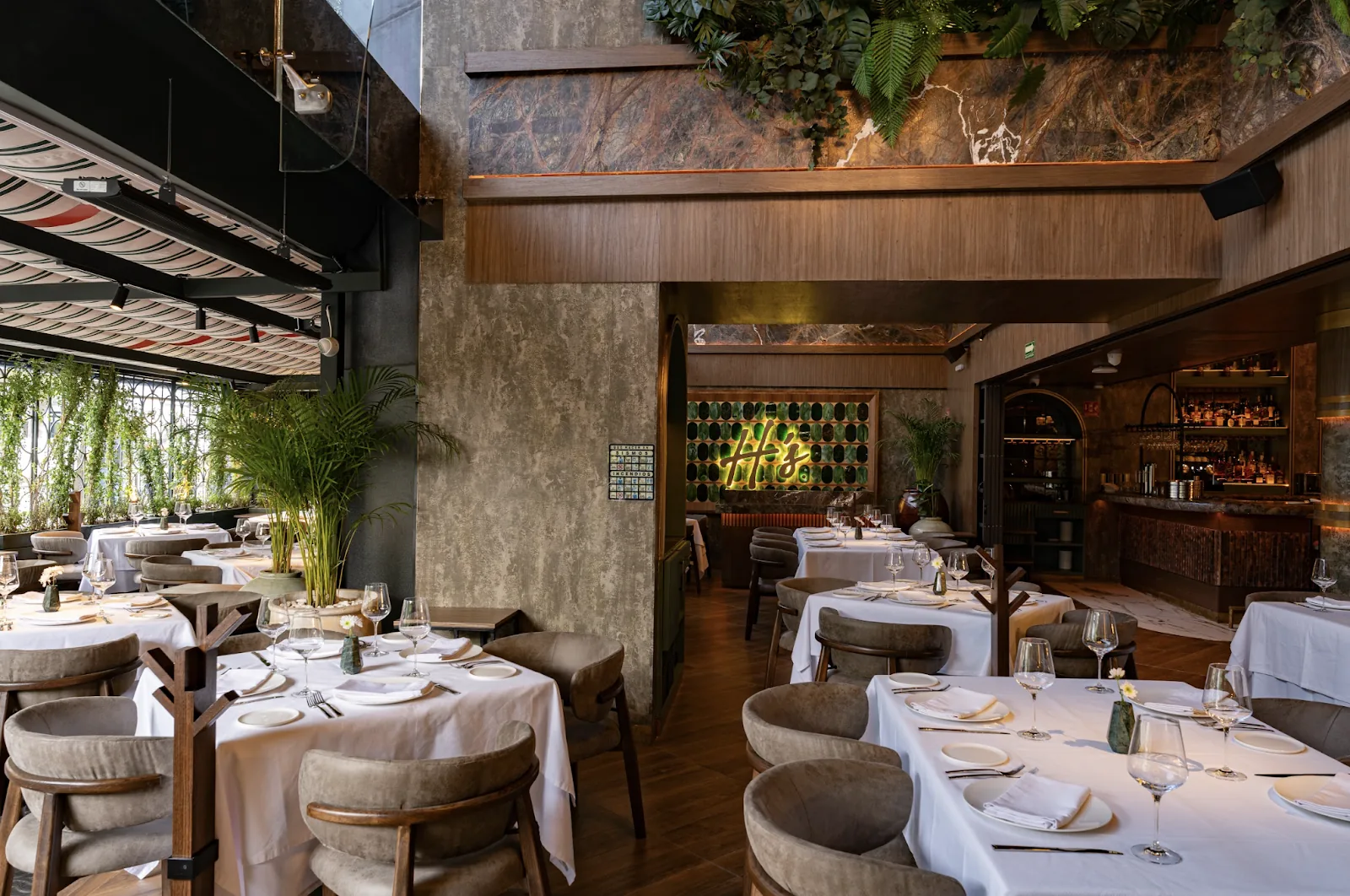Harry's - dining room with stone and greenery
