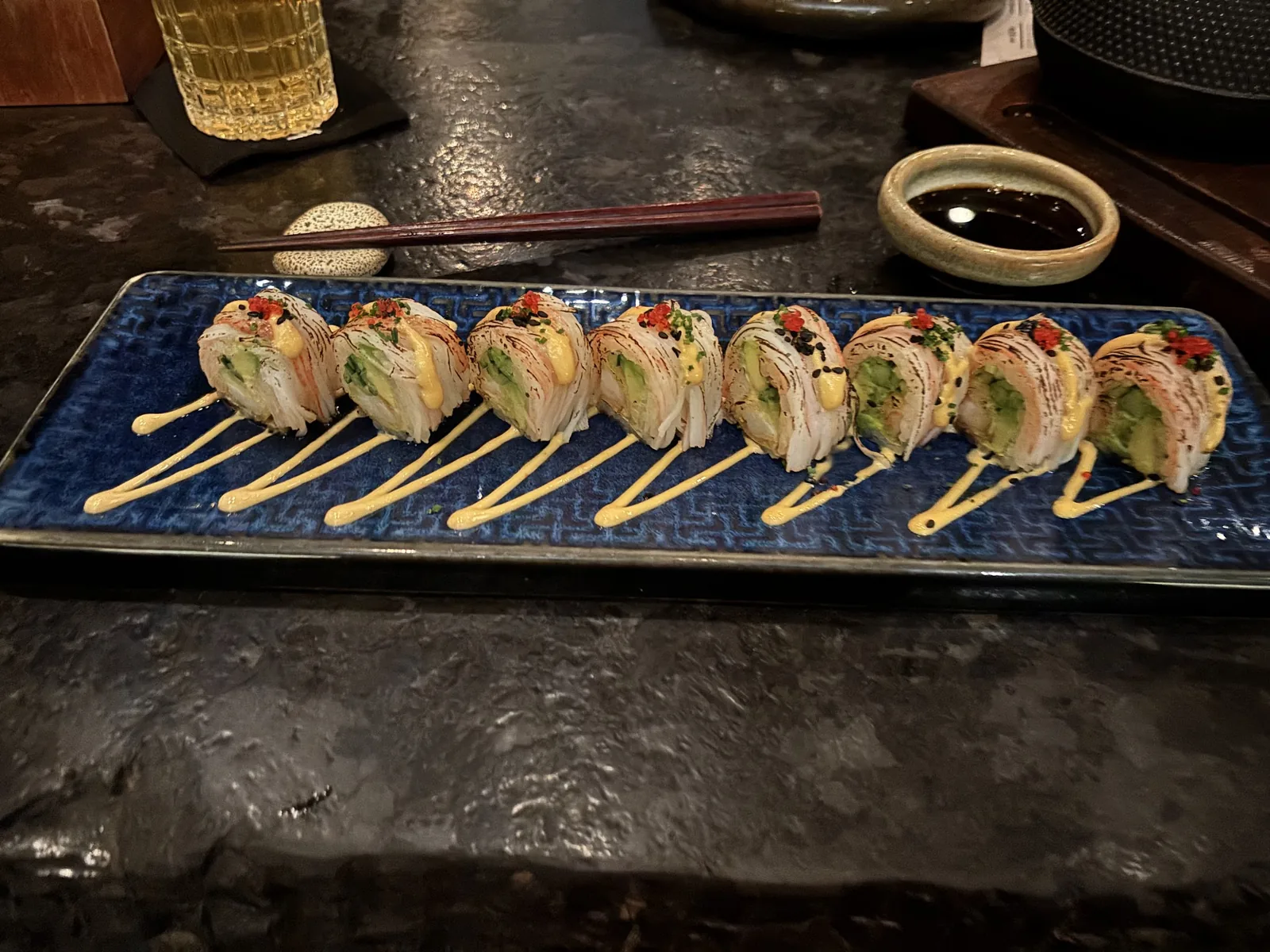 Hotaru Arcos - nigiri flight served on the counter