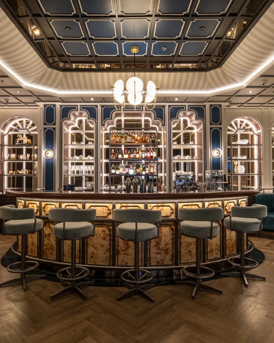 Inddee - add bar ornate blue coffered ceiling arched bottle shelves stools