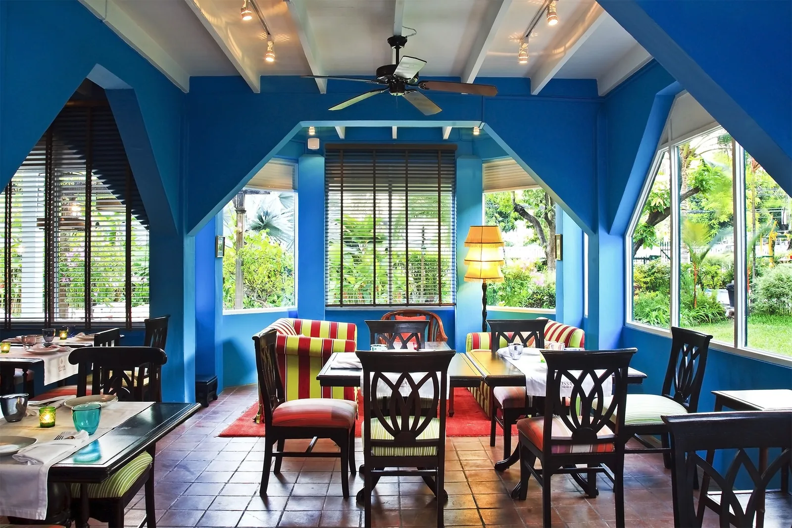 Issaya Siamese Club - cobalt blue colonial veranda dining room opening to the garden interior non food