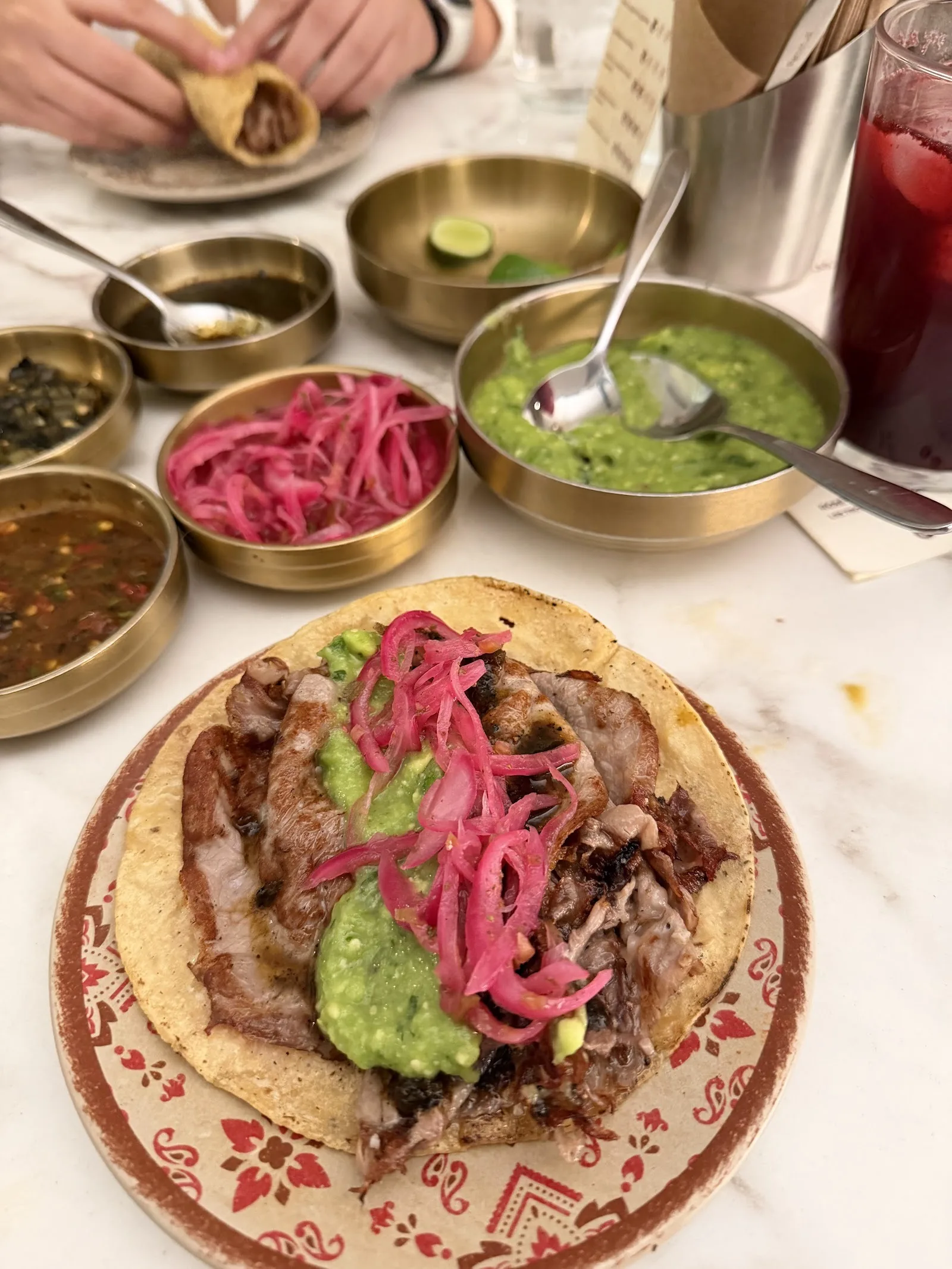 La Once Mil - taco de lechon with guacamole and pickle