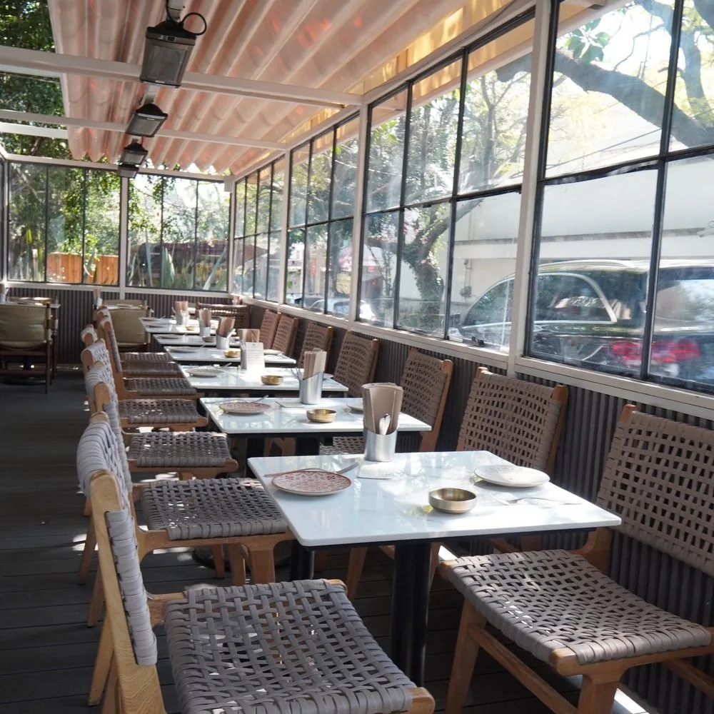 La Once Mil - glazed covered terrace with marble tops