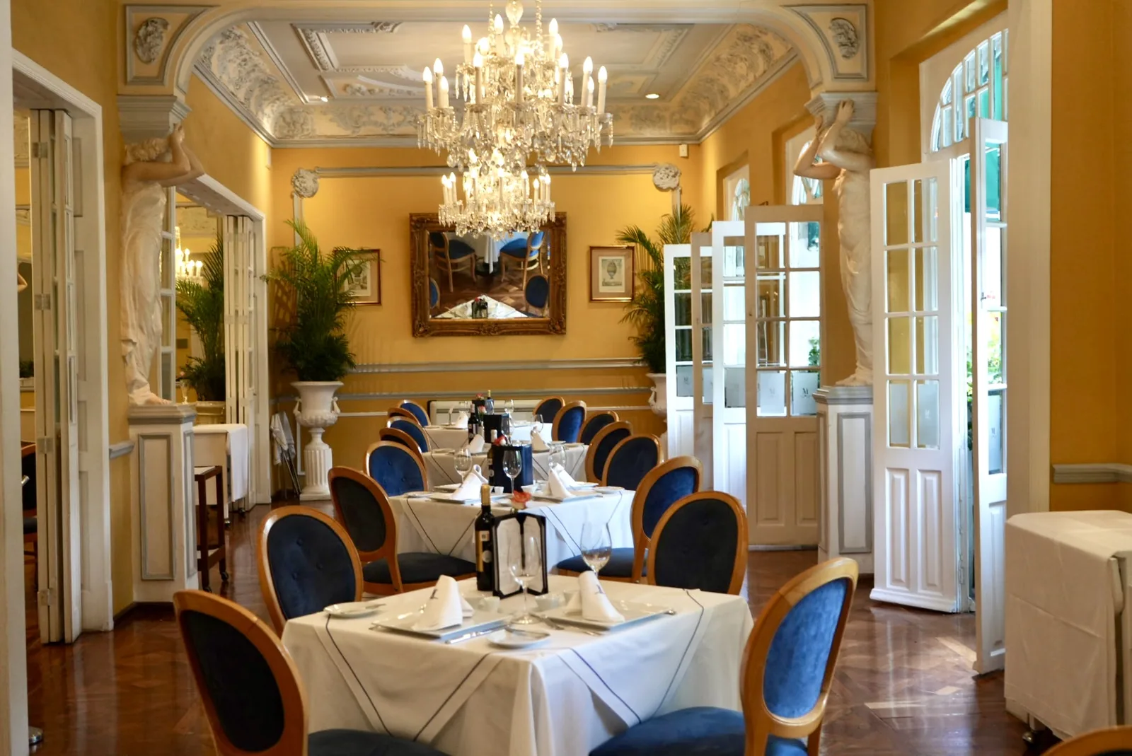 Les Moustaches - blue chair dining room