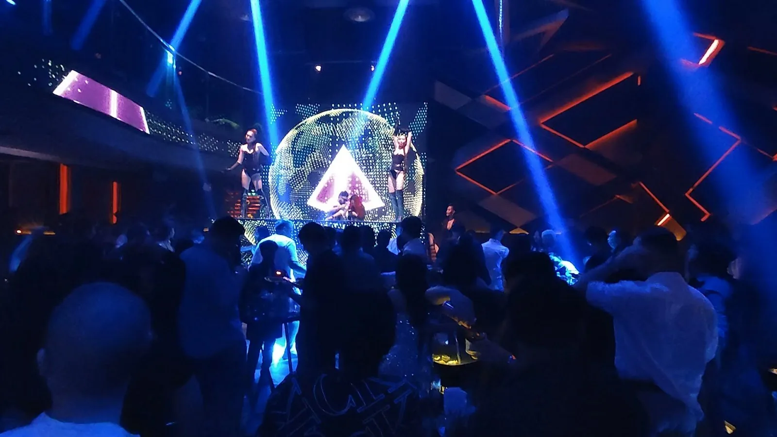 Levels Club & Lounge - fix wide main room with disco ball blue red laser rig and crowd silhouettes clean no watermark lower light phone shot