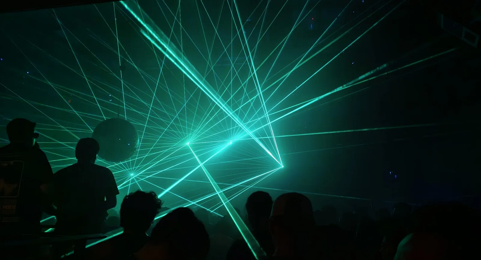Looloo Studio - green laser canopy over the crowd