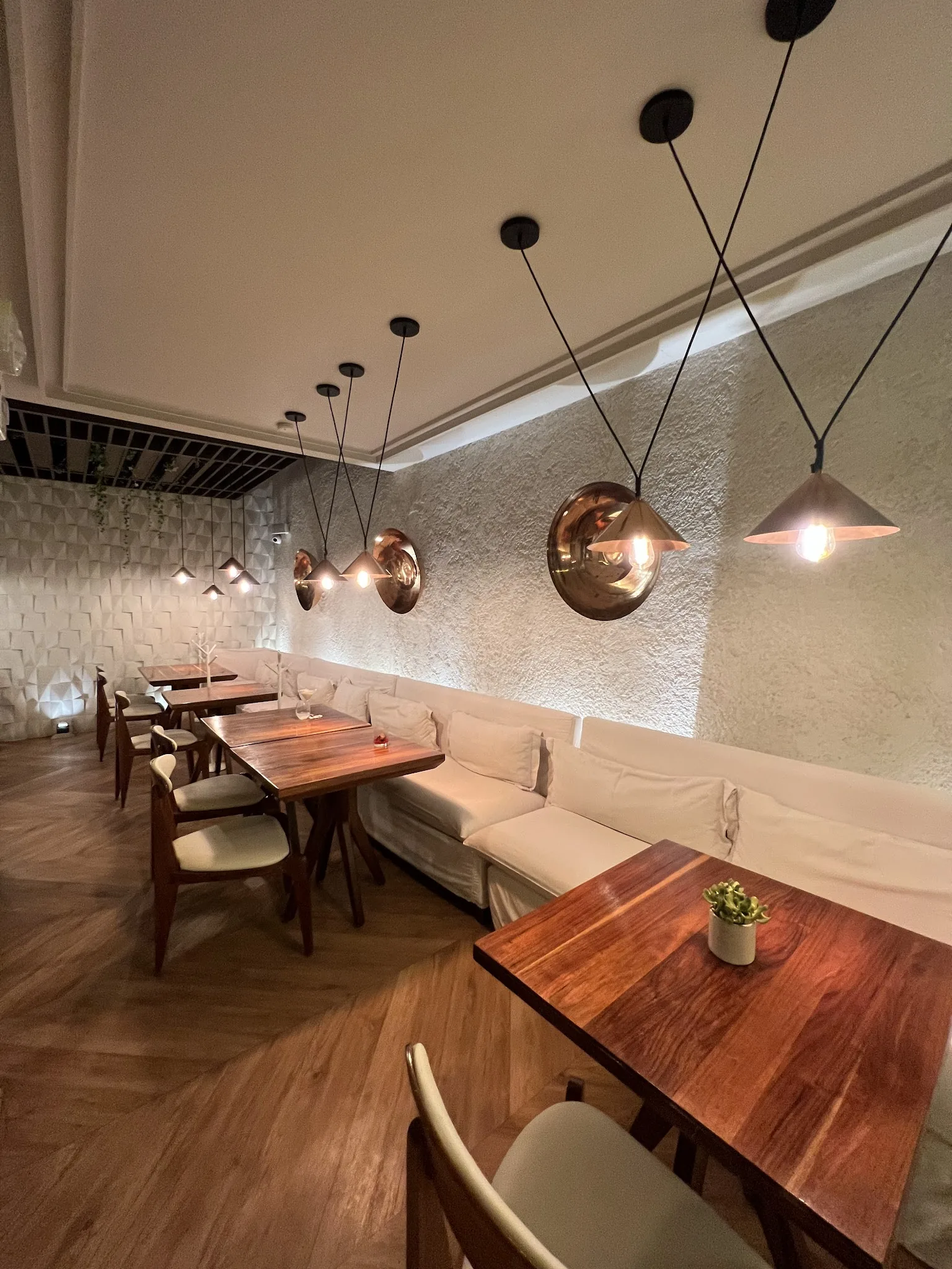 Loretta Chic Bistrot - interior under copper pendant lamps