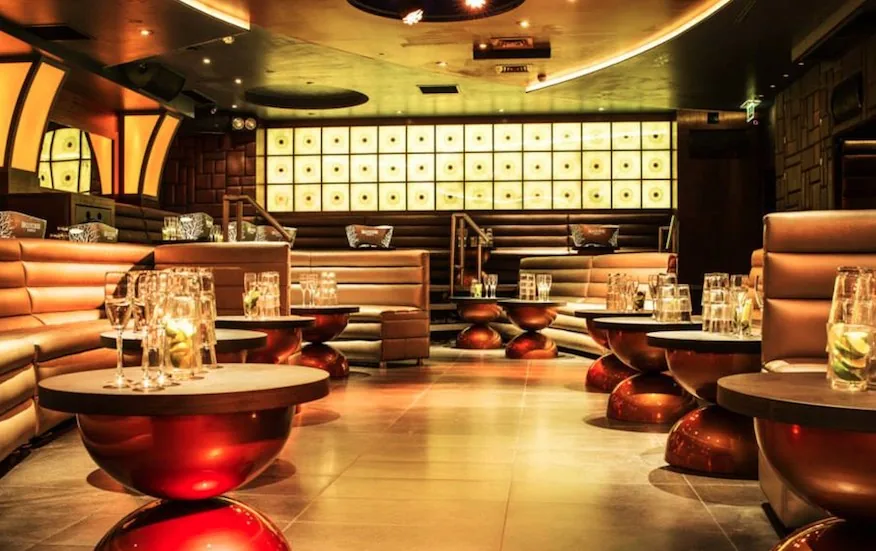 Maddox - lounge copper tables lit wall
