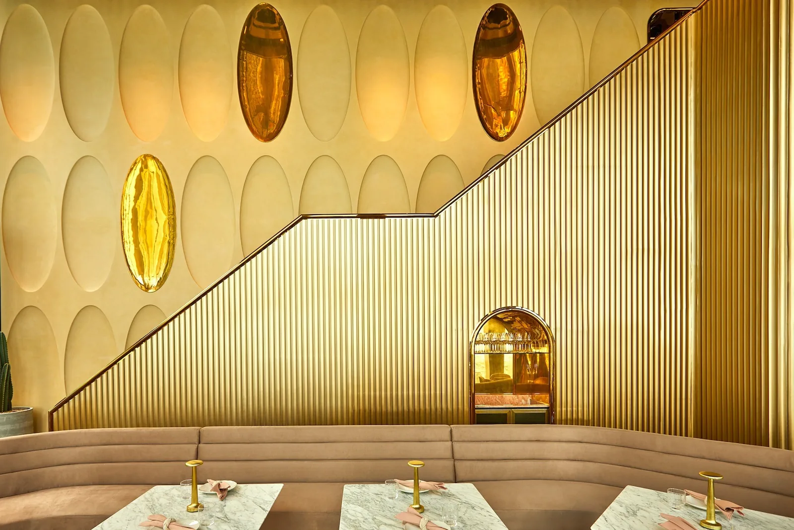 Ojo - gold pleated wall banquette