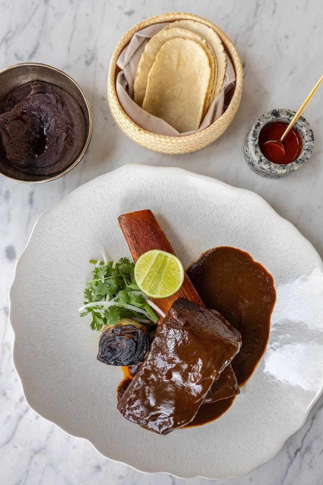 Ojo - birria mole plate
