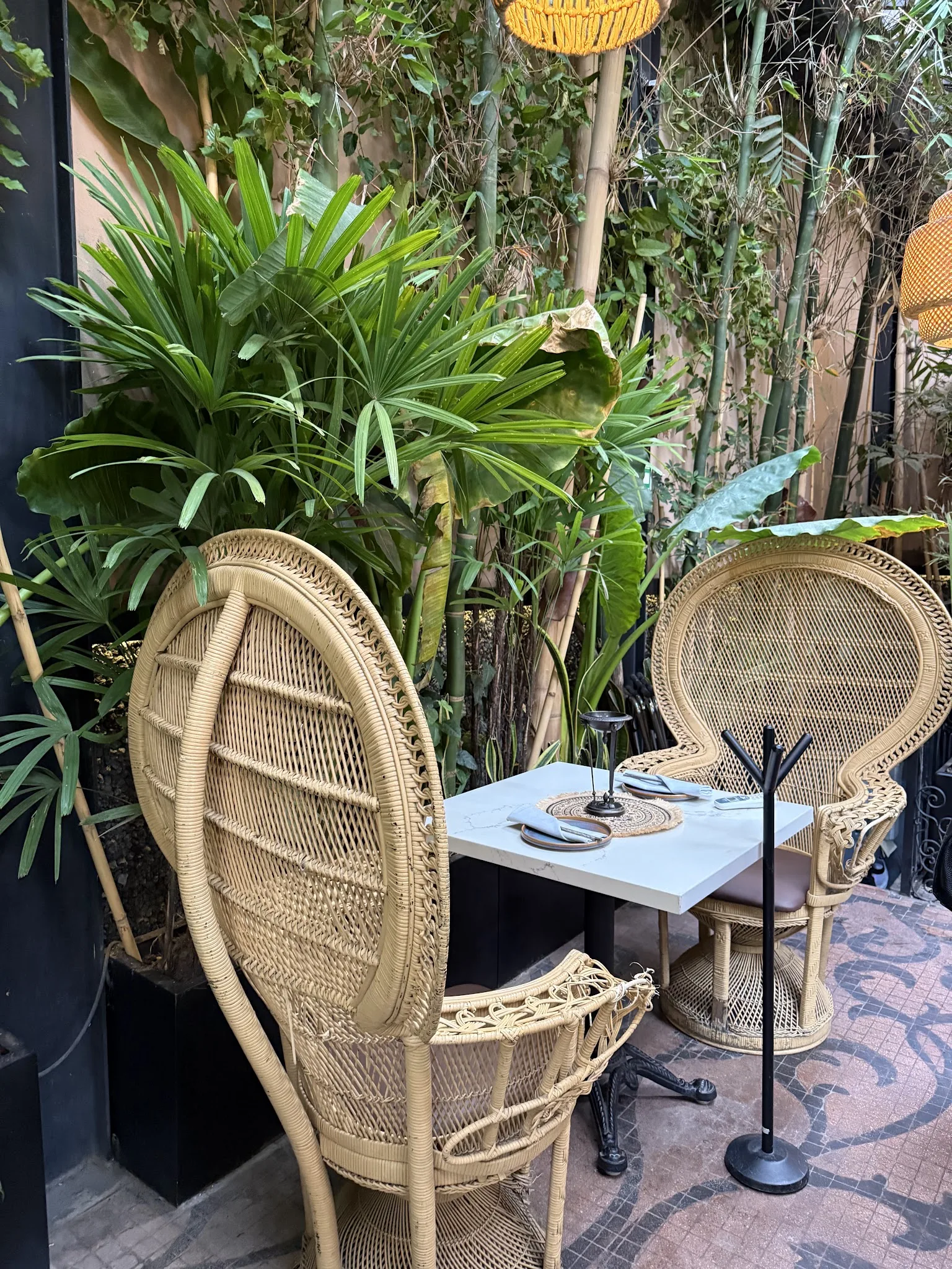 Manaw - garden terrace with rattan chairs