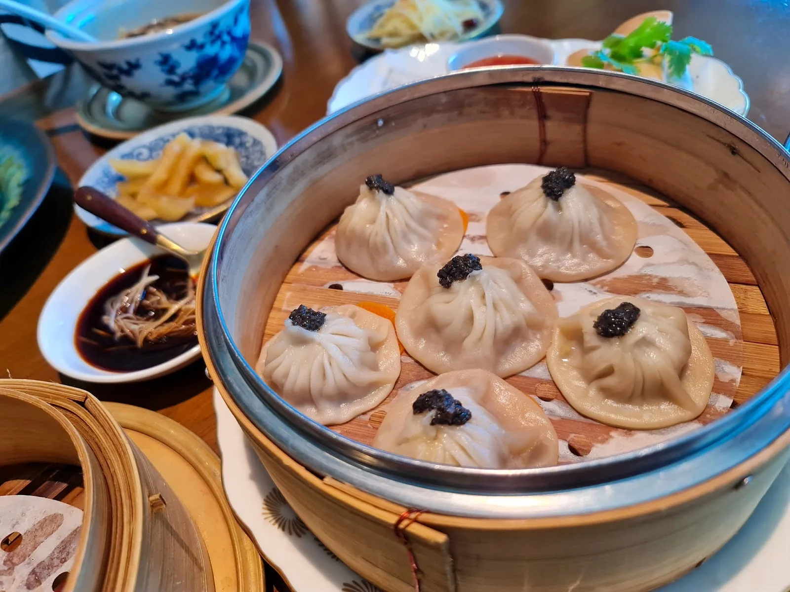 Nan Bei - xiao long bao soup dumplings in bamboo steamer
