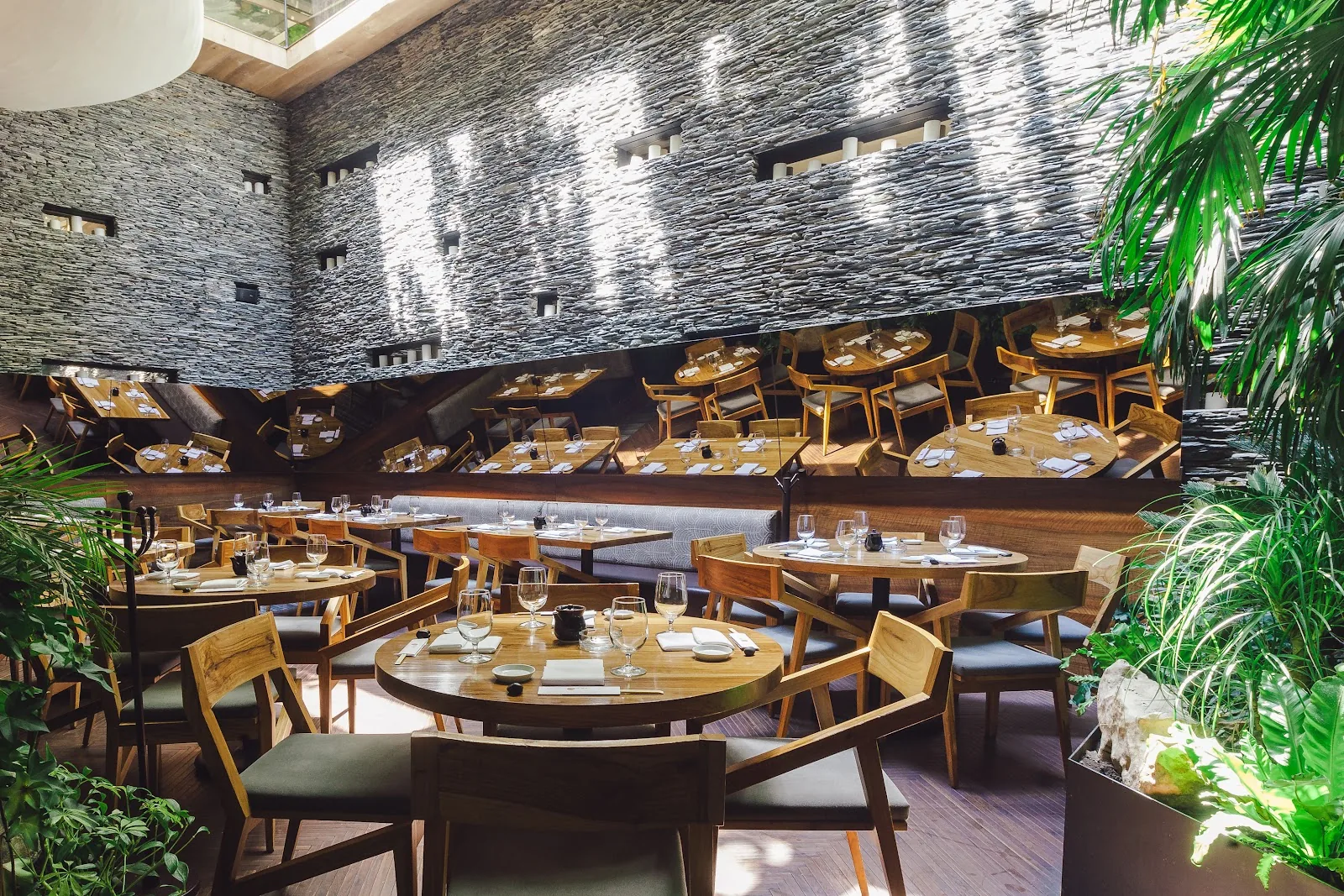 Nobu - dining room stone wall greenery
