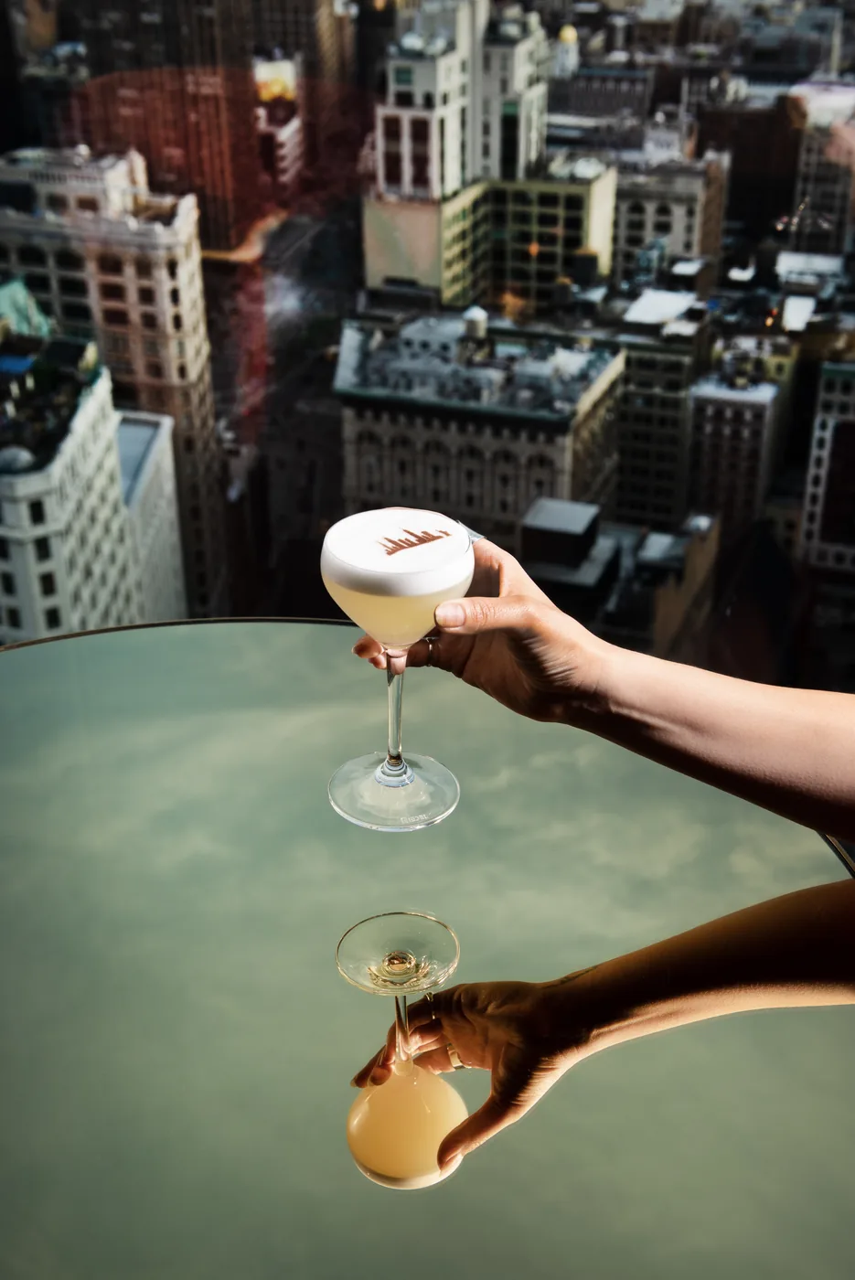 Nubeluz - signature cocktail with skyline