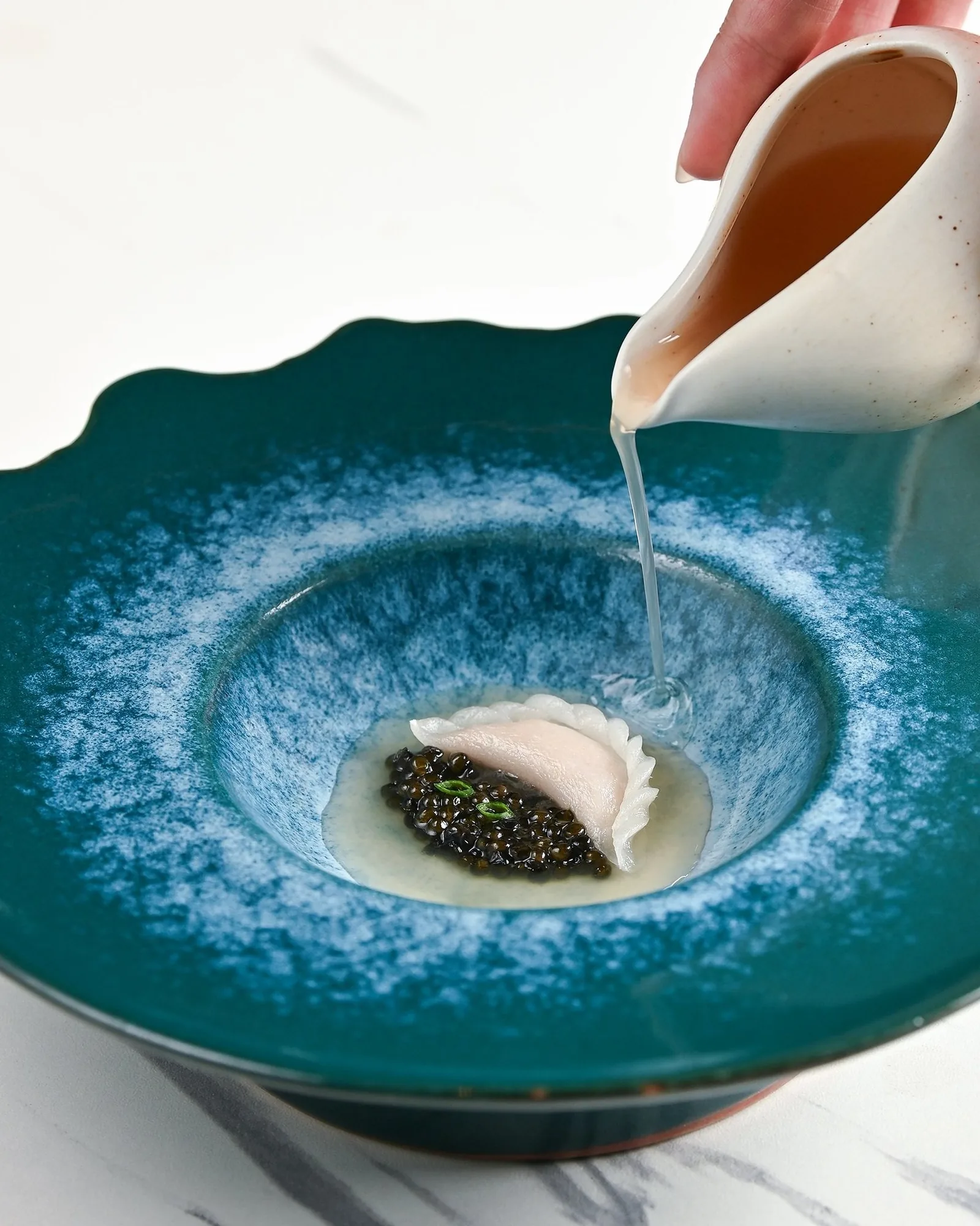 Nusara - food caviar broth course