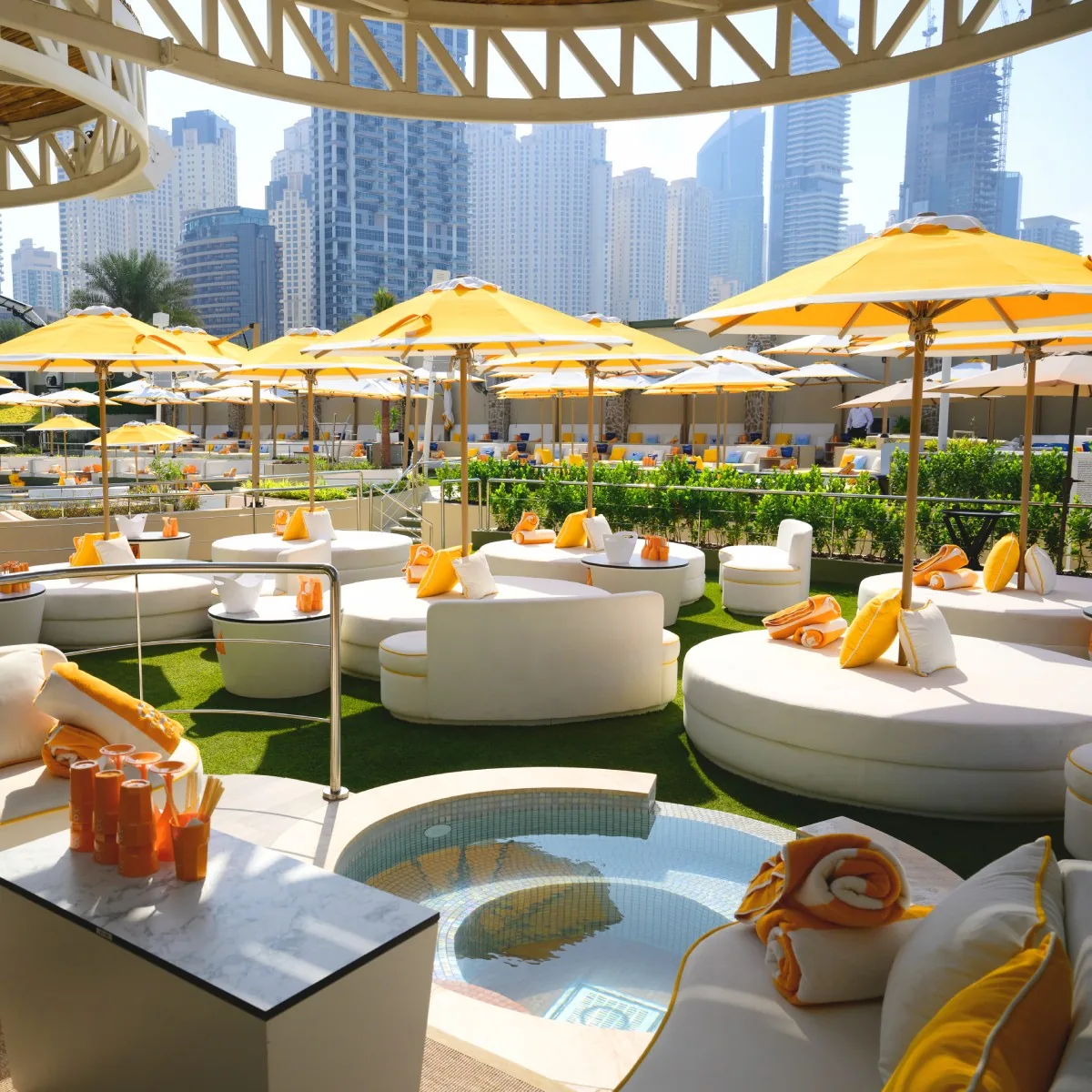 O Beach - vip daybeds marina skyline yellow umbrellas