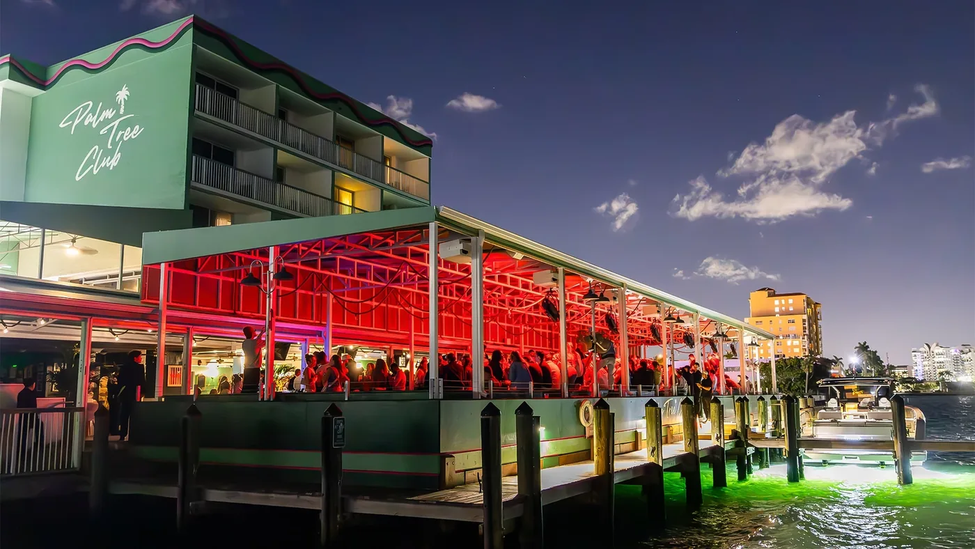 Palm Tree Club - dusk waterfront exterior