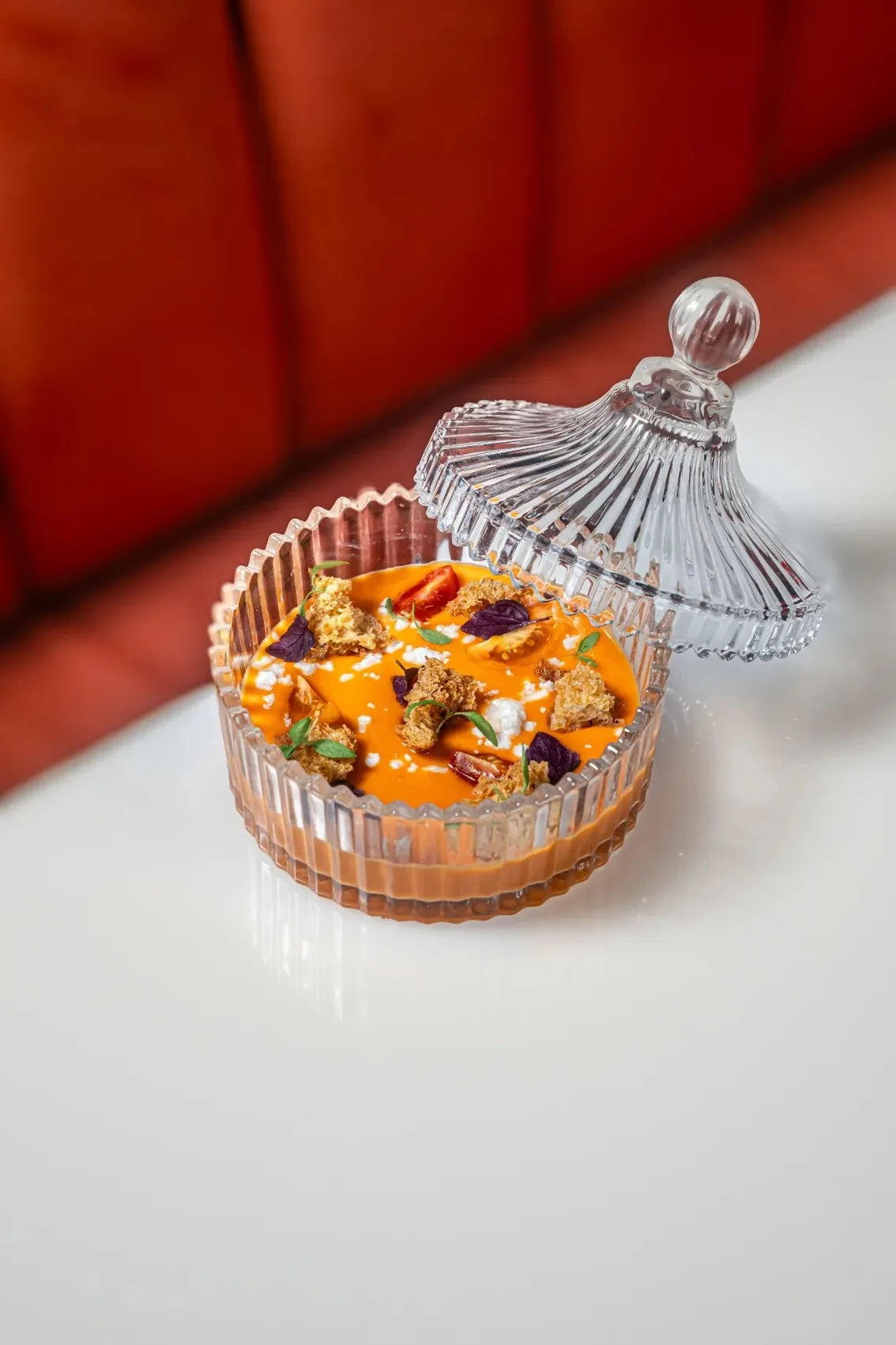 Pastel - plated dessert in a glass dish