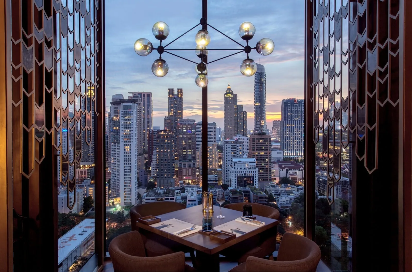 Penthouse Bar - indoor dining chandelier skyline