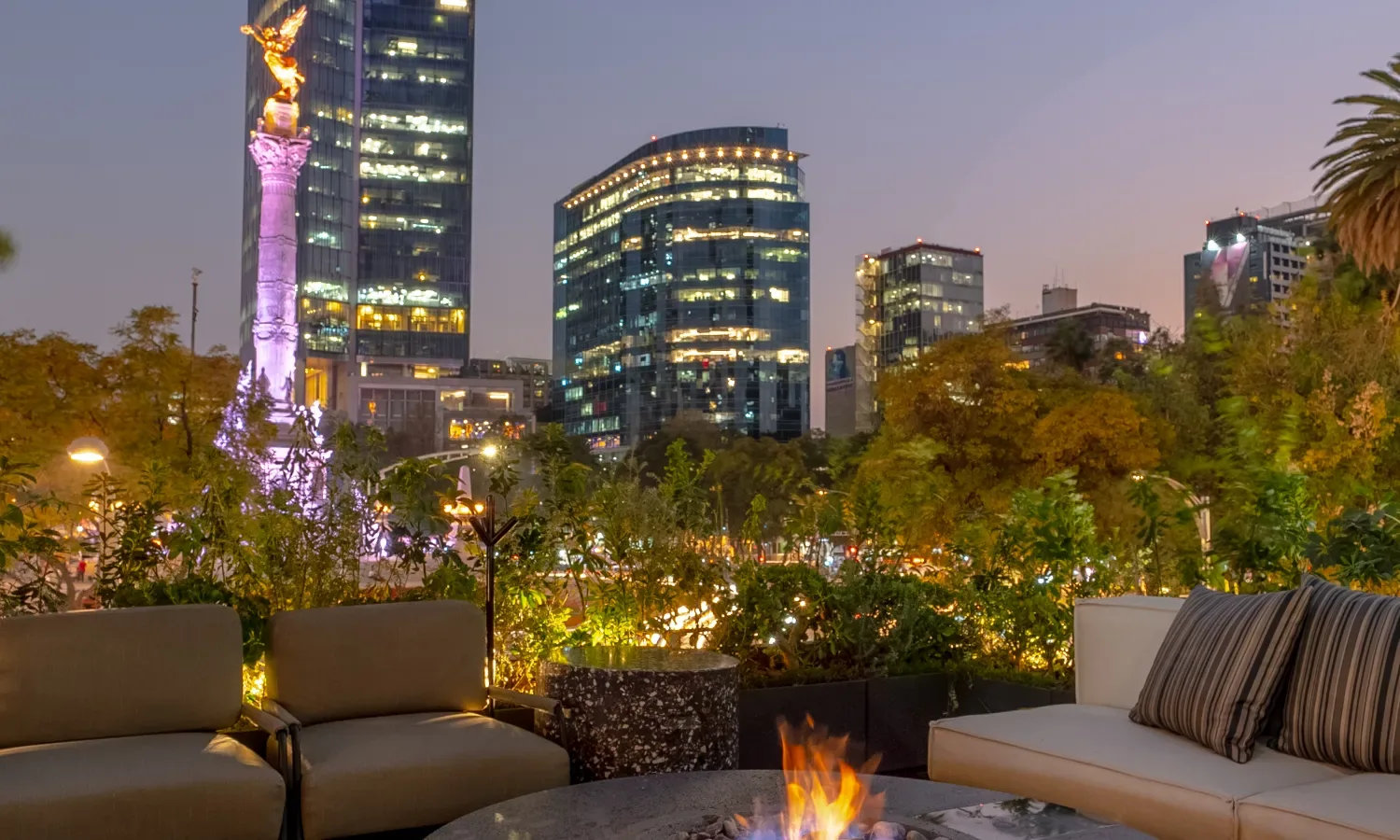 Prime Steak Club - terrace fire pit with the angel de la in