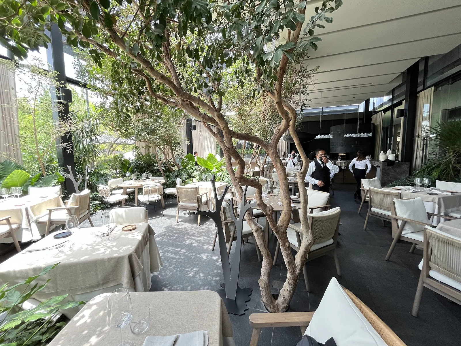 Quattro Gastronomia Italiana - garden terrace tables