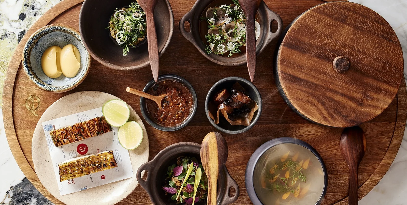 Quintonil - table set with tasting dishes