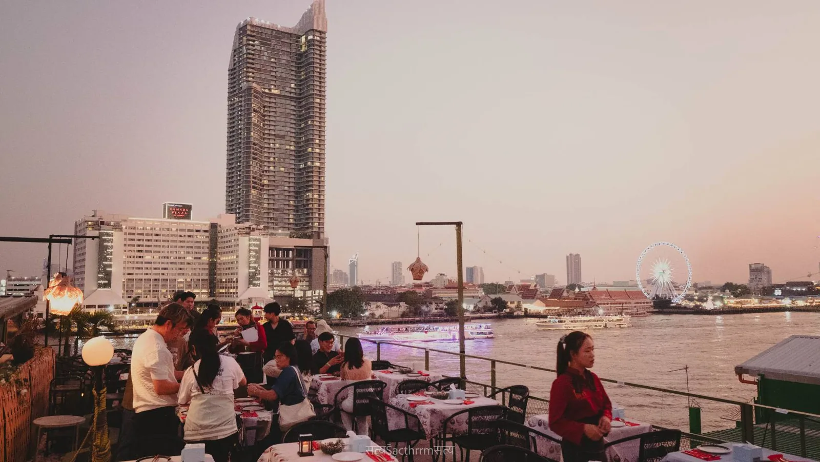 Rim Rooftop Dining - rooftop tables skyline dusk