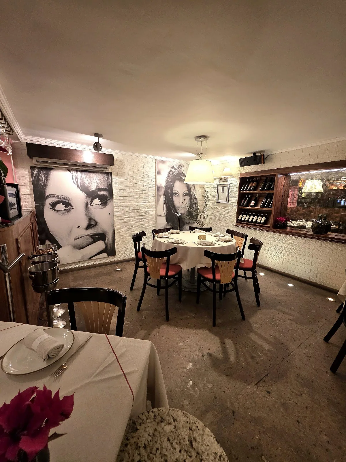 Ristorante Romina - interior dining room portrait wall