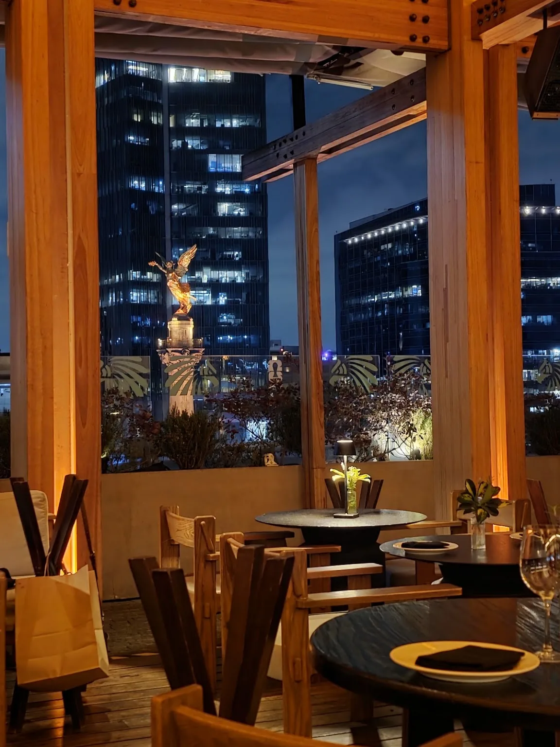 Salazar - terrace seating at night facing the ange
