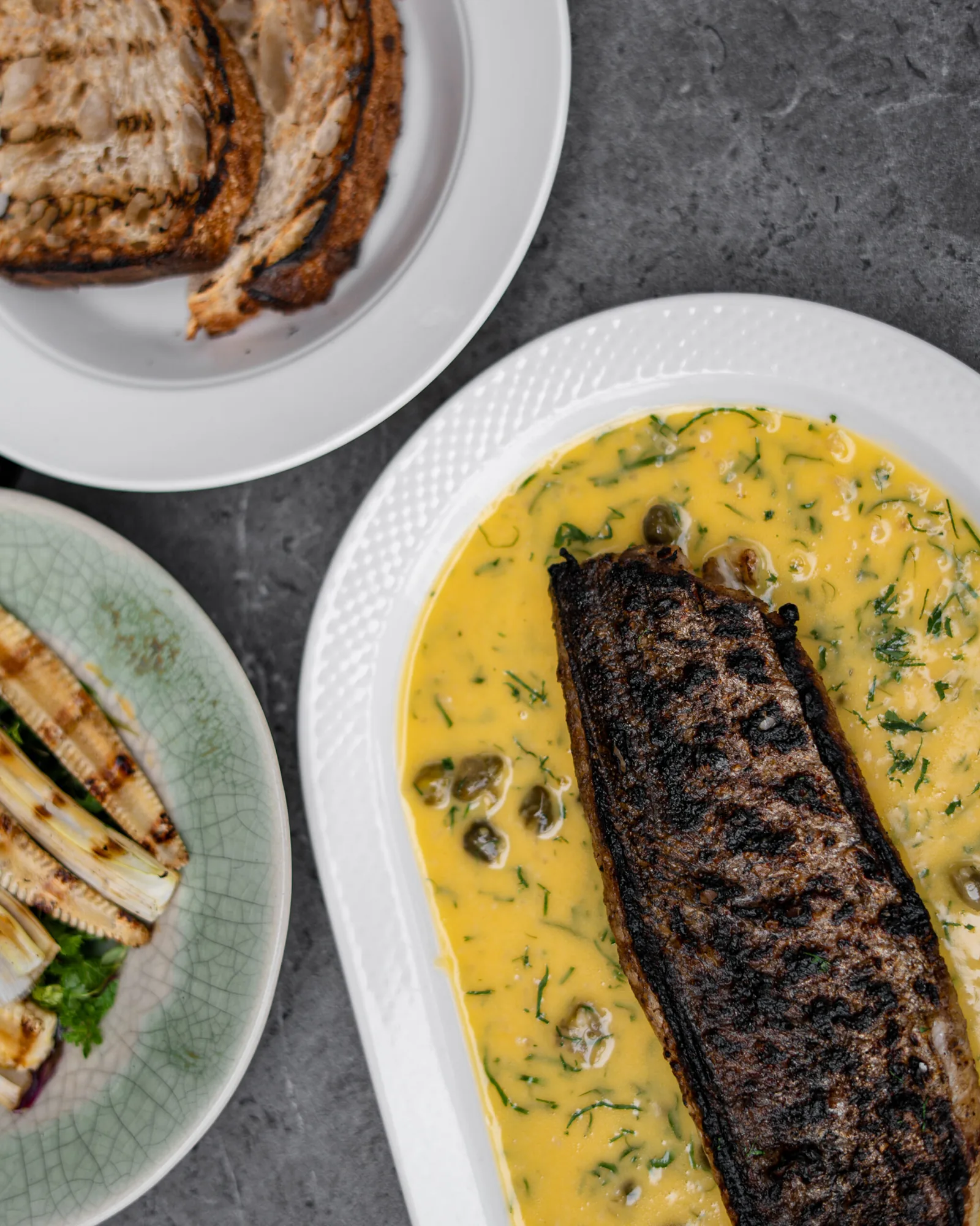 Salazar - grilled fish in herb butter with capers